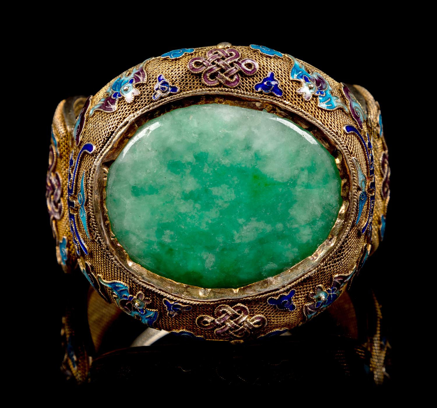 An Apple Green and Pale Celadon Jadeite Inset and Enamel Inlaid Silver-Gilt Filigree Bracelet