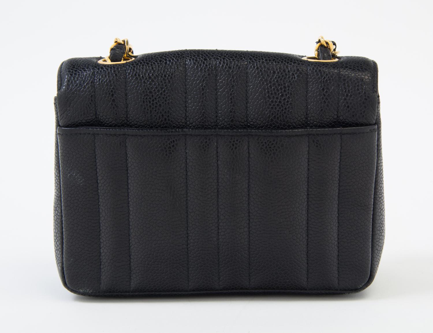 A Chanel Black Caviar Quilted Small Flap Bag, 7" x 5" x 2"; Strap drop: 21".