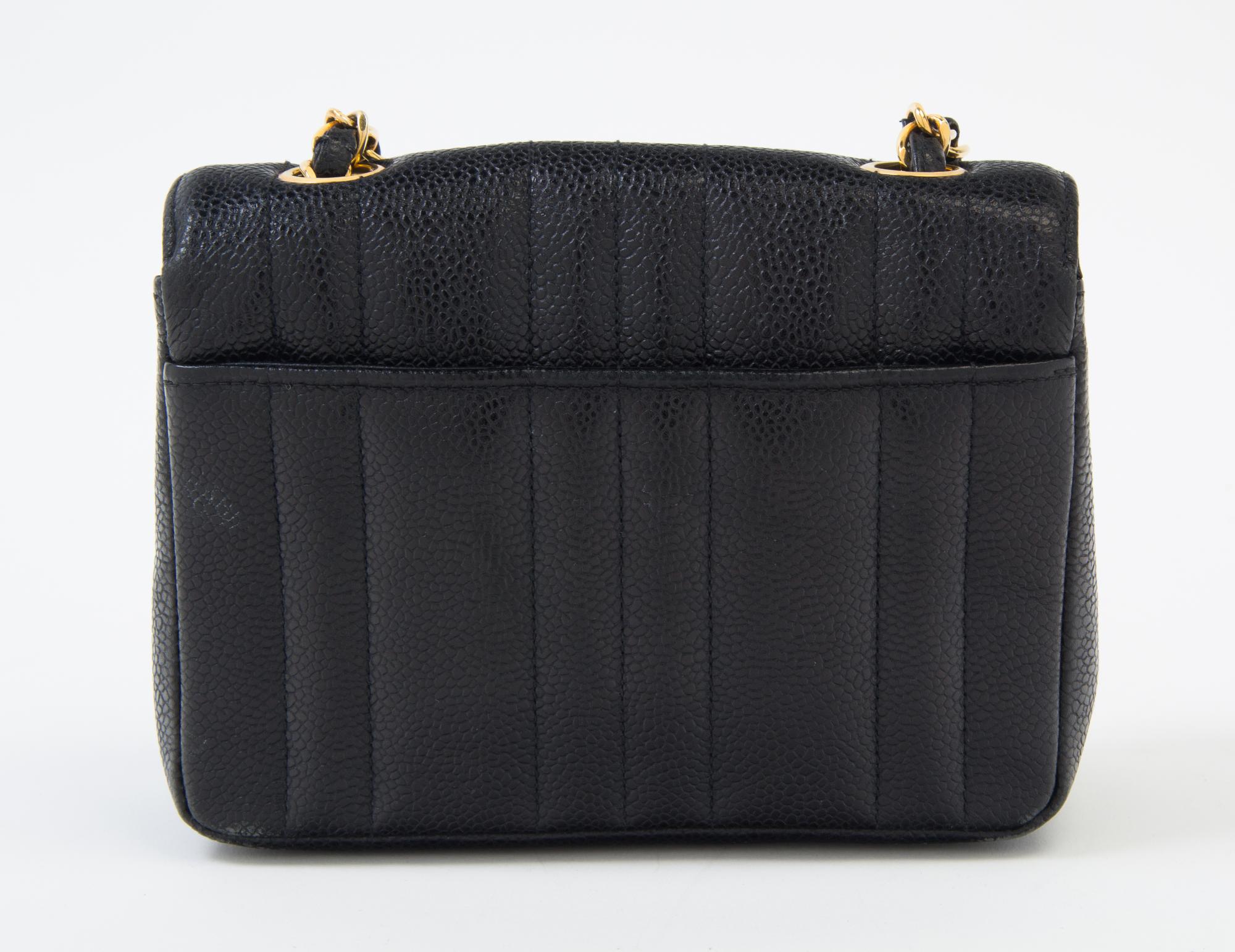 A Chanel Black Caviar Quilted Small Flap Bag, 7" x 5" x 2"; Strap drop: 21".