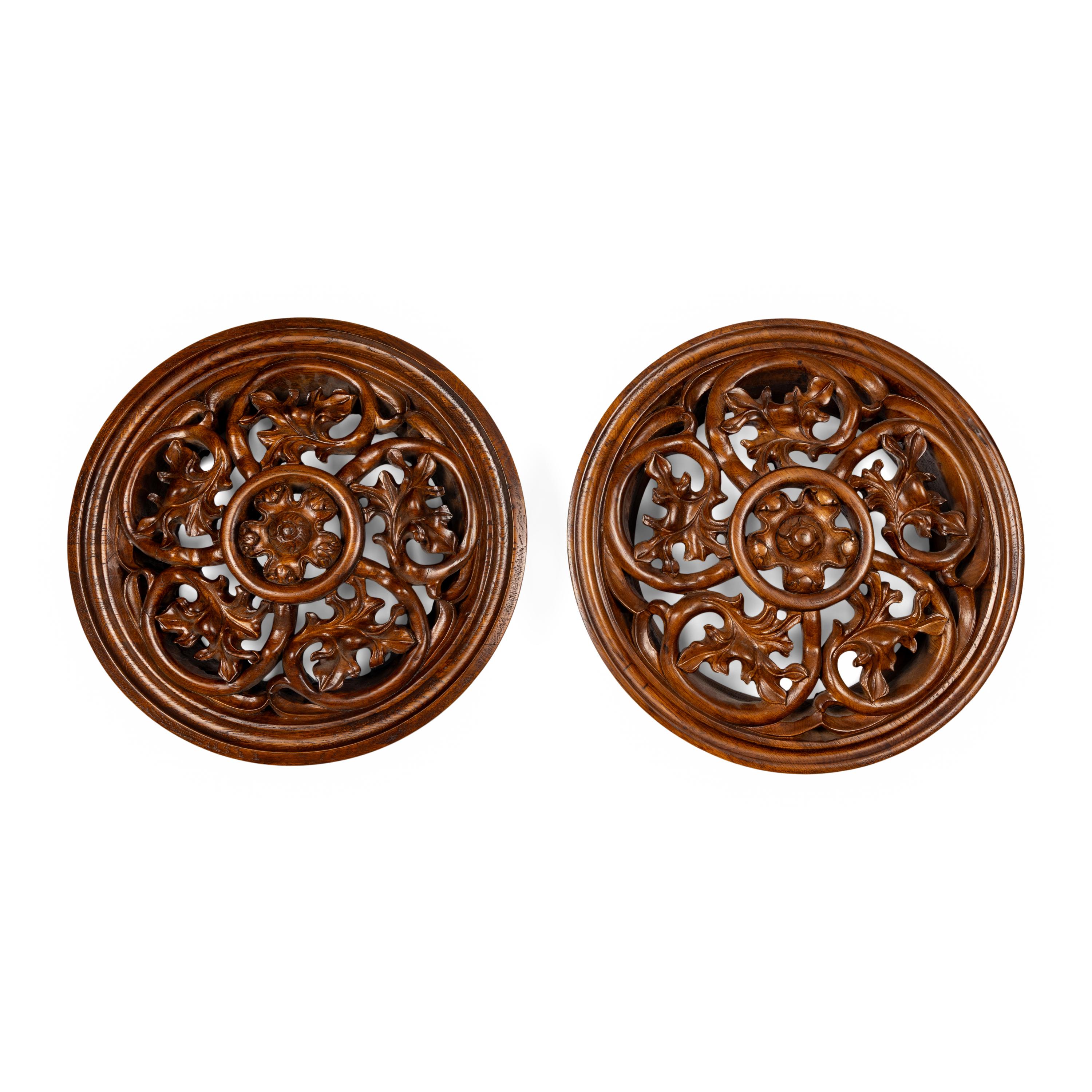 A Pair of Carved Oak Roundels