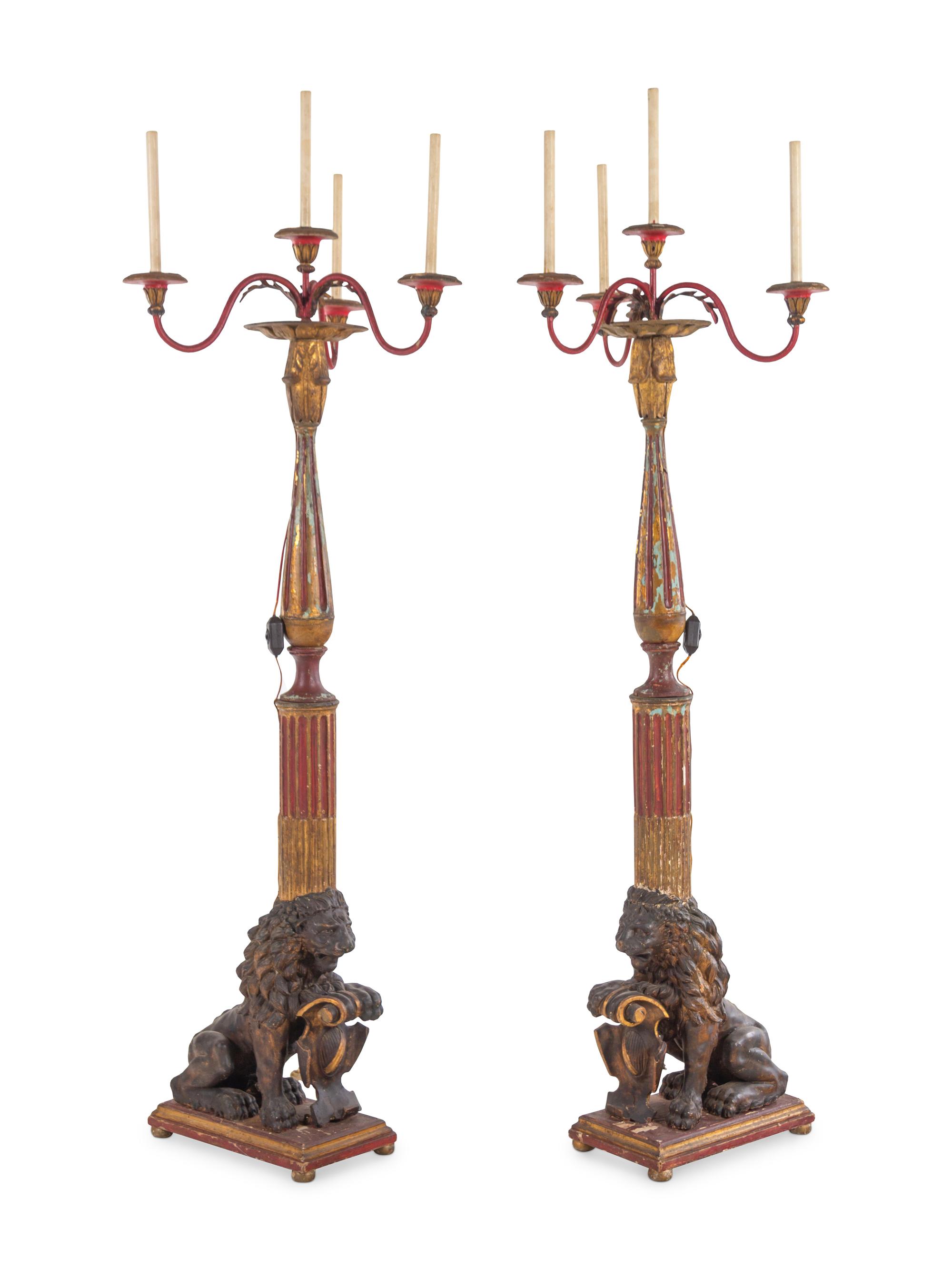 A Pair of Italian Painted and Parcel Gilt Four-Light Torchères