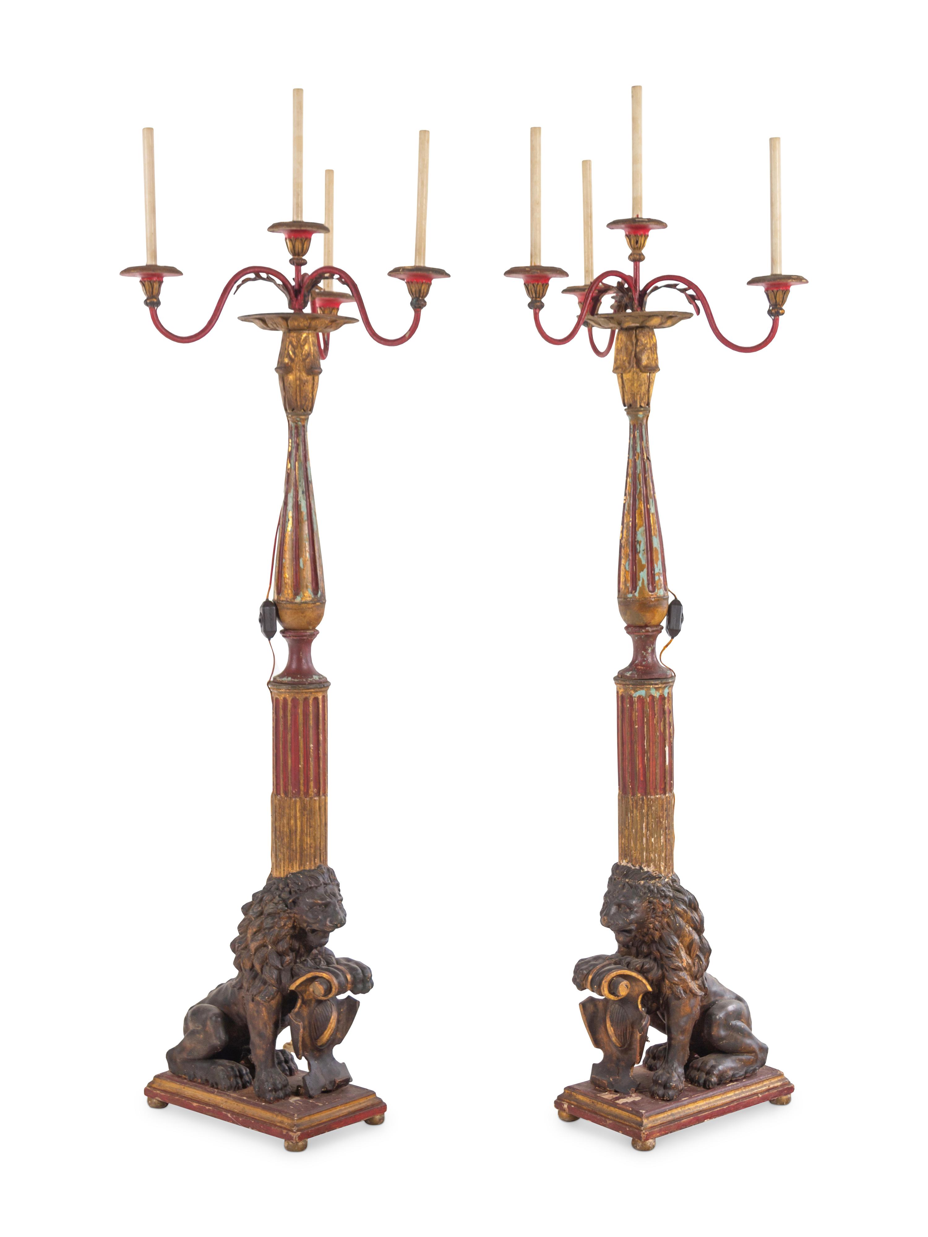 A Pair of Italian Painted and Parcel Gilt Four-Light Torchères