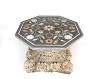 A Pietra Dura and Scagliola Hexagonal Tabletop on an Indian Corinthian Capital-Form Base — 20TH CENTURY