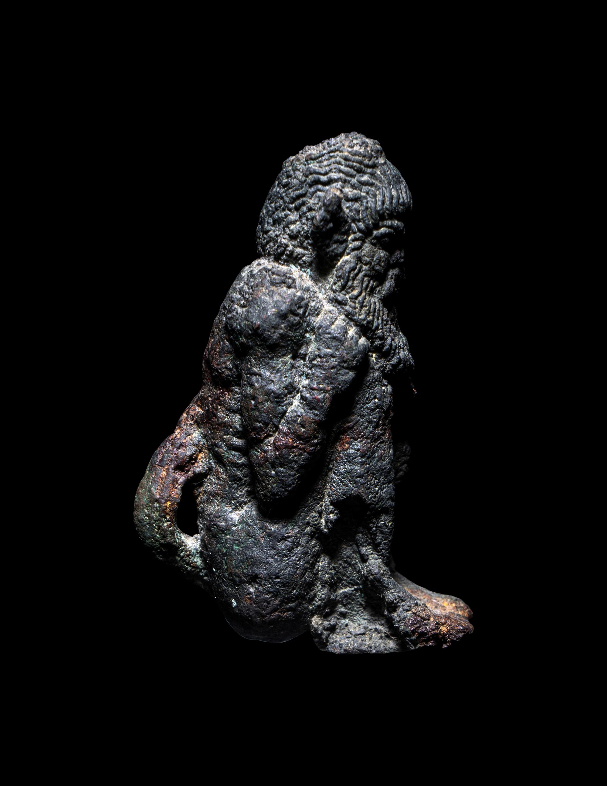 A Greek Bronze Satyr