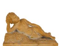 A Pair of Marble Models of Sleeping Cherubs on Plinths
