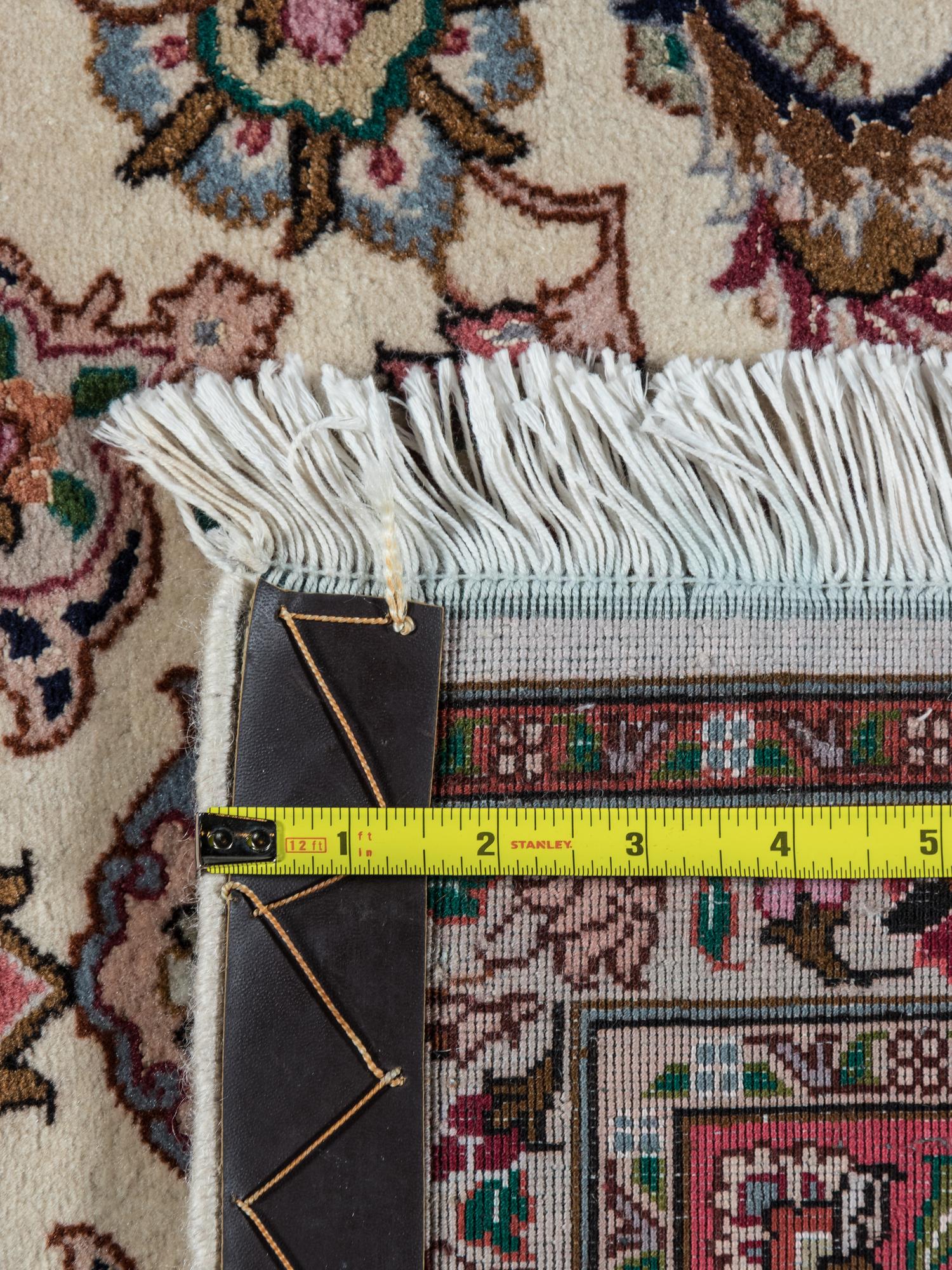 A Tabriz Wool Rug