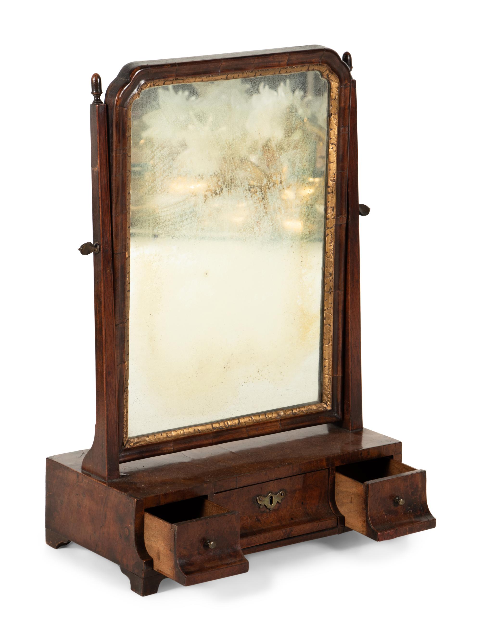 A George II Parcel Gilt Walnut Dressing Mirror