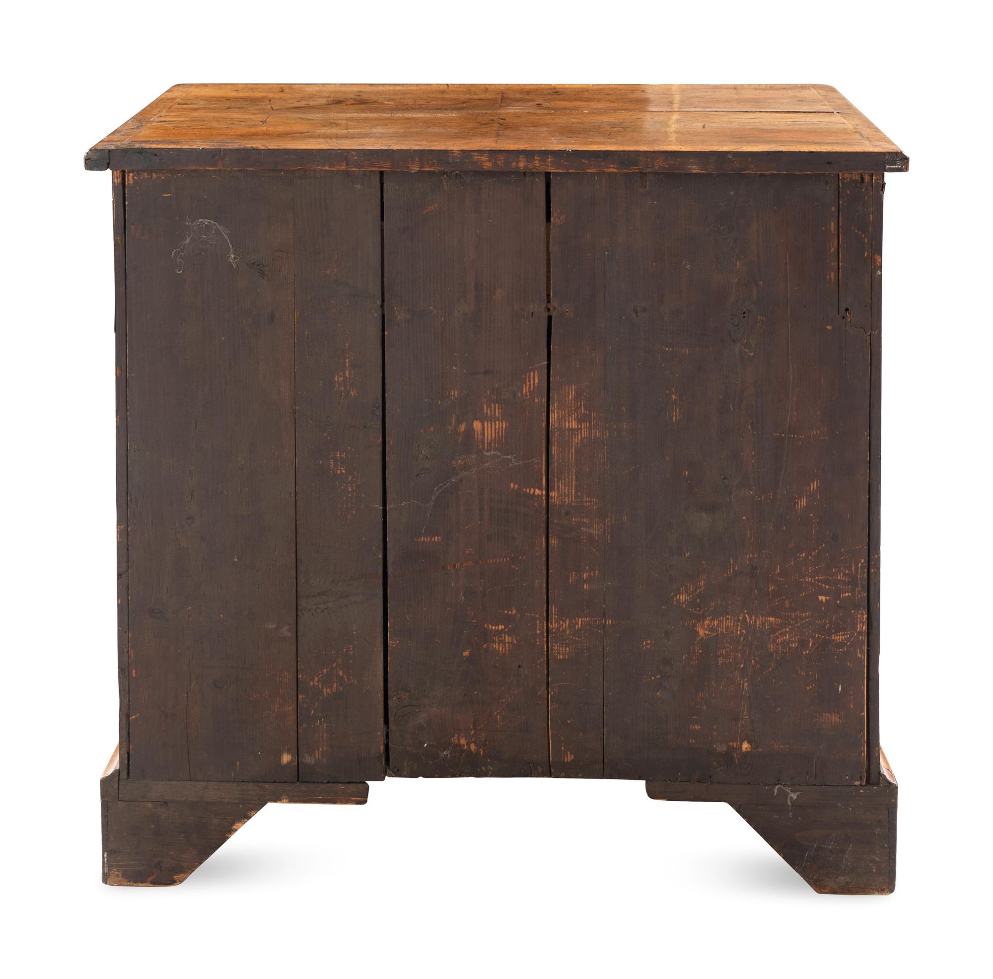 A George I Walnut Kneehole Desk