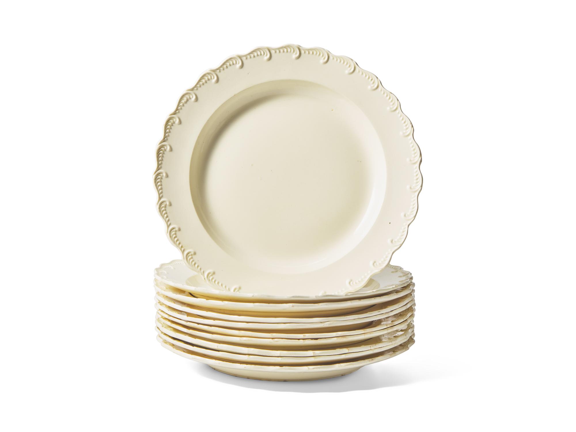 A Set of Ten Scalloped Creamware Dinner Plates