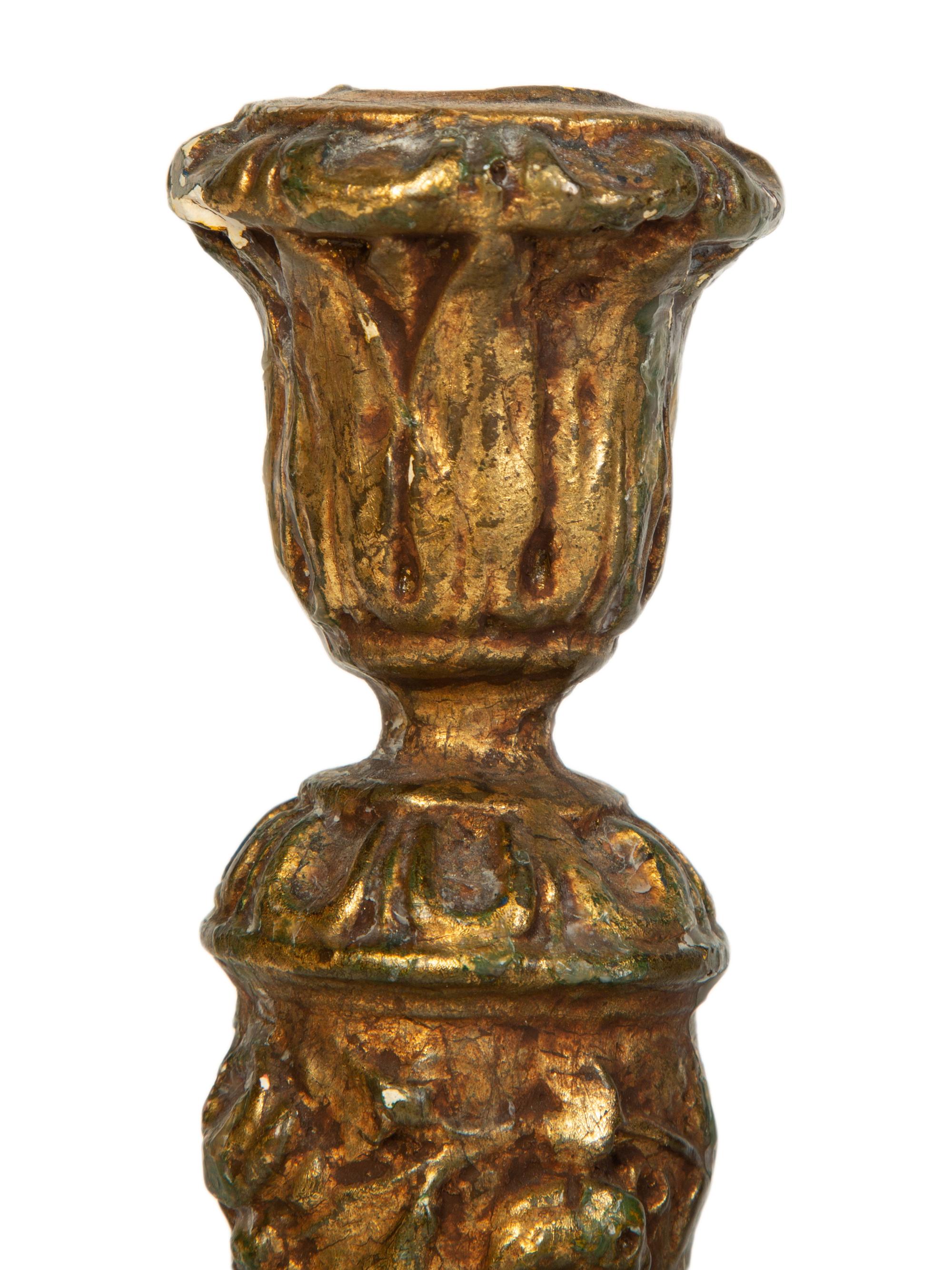 A Pair of Carved Giltwood Candlesticks