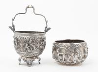A Group of Southeast Asian Silver Articles, , comprising four spoons, four serving spoons, one pair of tongs, and two bowls.