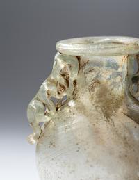 A Roman Green Glass Araballos