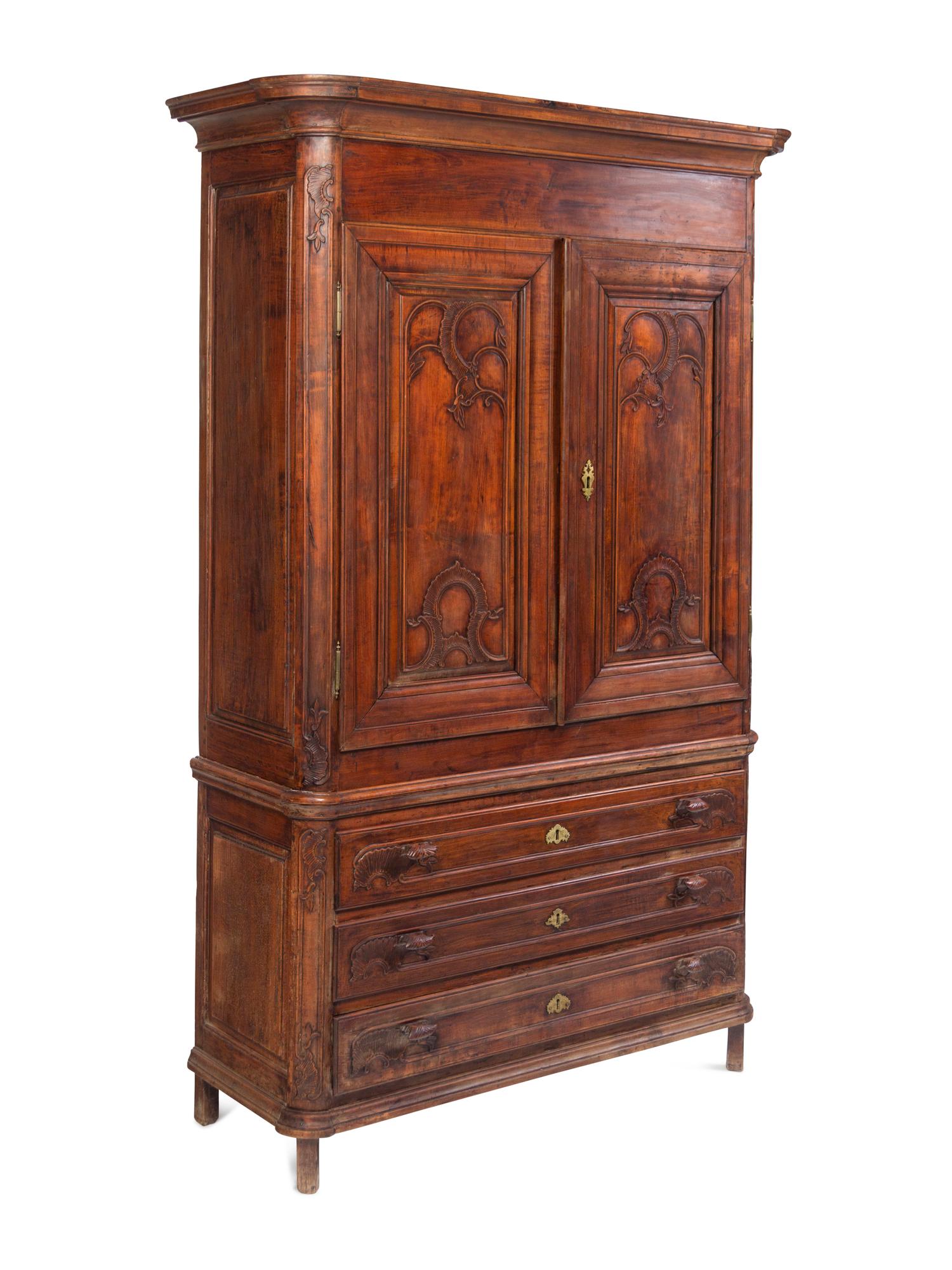 A Louis XV Carved Walnut Cabinet