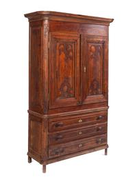 A Louis XV Carved Walnut Cabinet