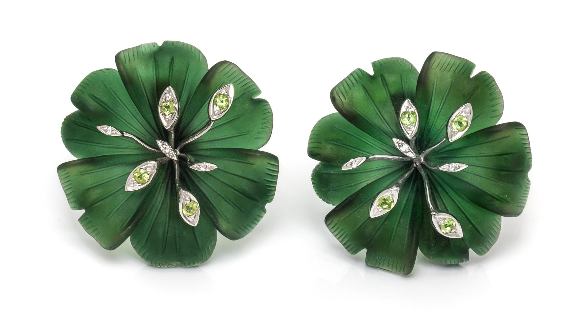 A Pair of 18 Karat White Gold, Green Glass, Diamond and Peridot Flower Motif Earclips, 21.70 dwts.