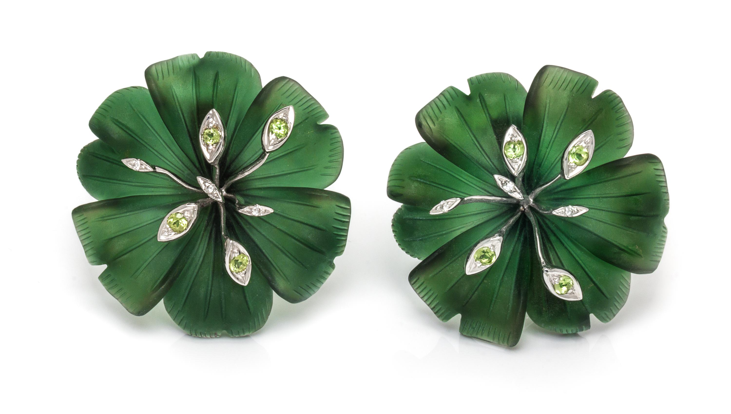 A Pair of 18 Karat White Gold, Green Glass, Diamond and Peridot Flower Motif Earclips, 21.70 dwts.