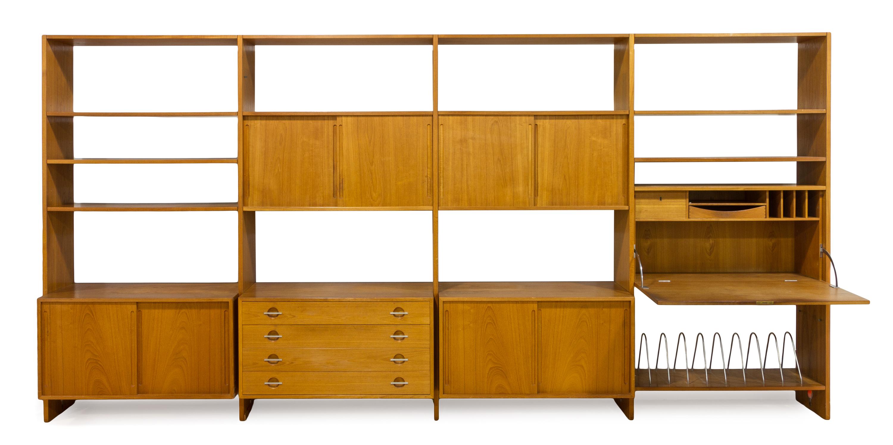 A Four-Part Teak Wall Unit, Hans Wegner for Ry Mobler Height of each part 81 1/4 x width 40 1/2 x depth 19 1/4 inches.