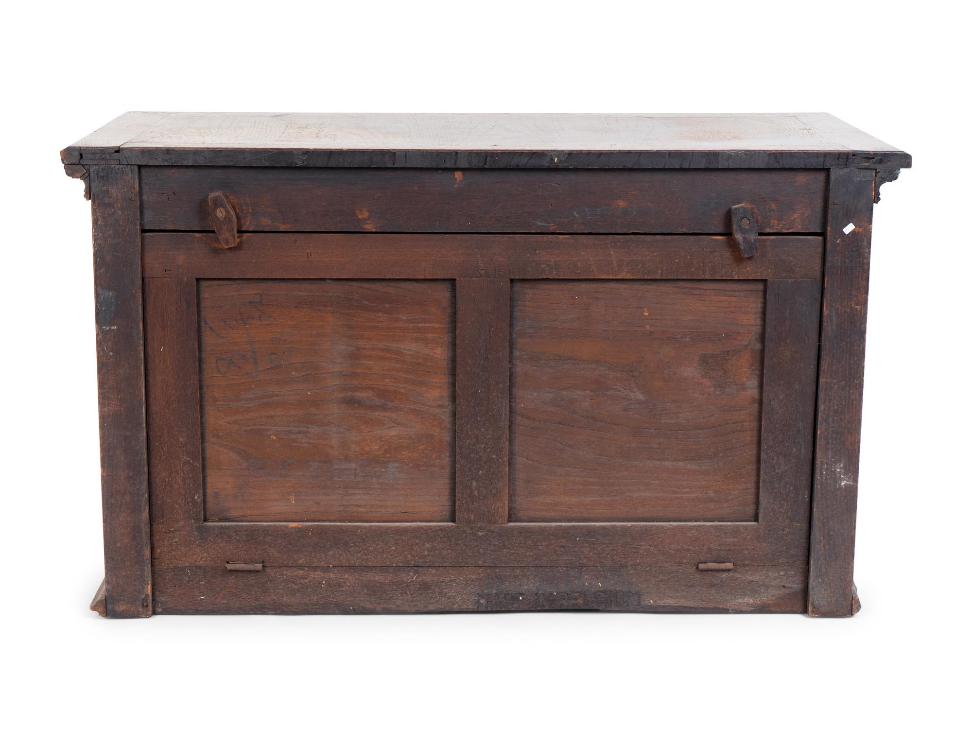 A Renaissance Revival Carved Oak Trunk with Iron Mounts — 19TH/20TH CENTURY