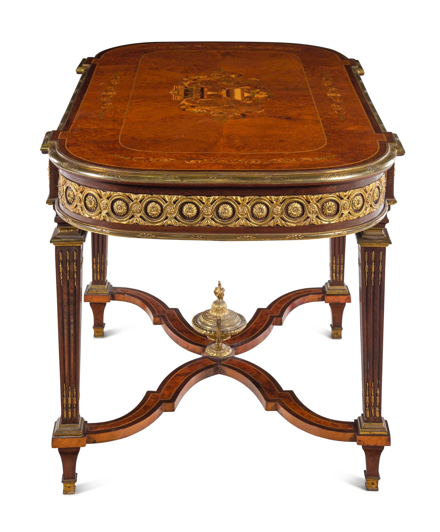 A Louis XVI Style Gilt Bronze Mounted Amboyna and Marquetry Center Table