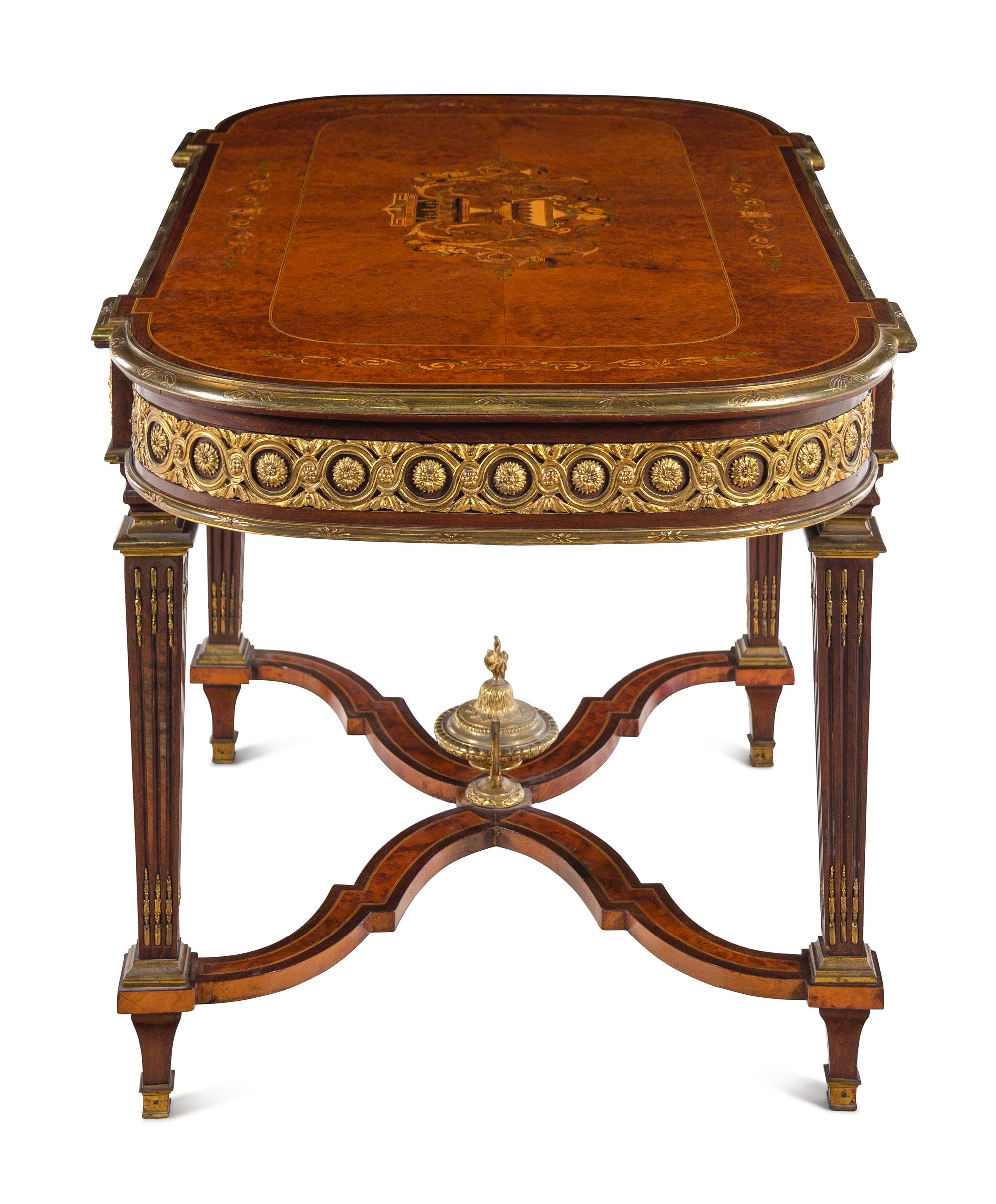 A Louis XVI Style Gilt Bronze Mounted Amboyna and Marquetry Center Table