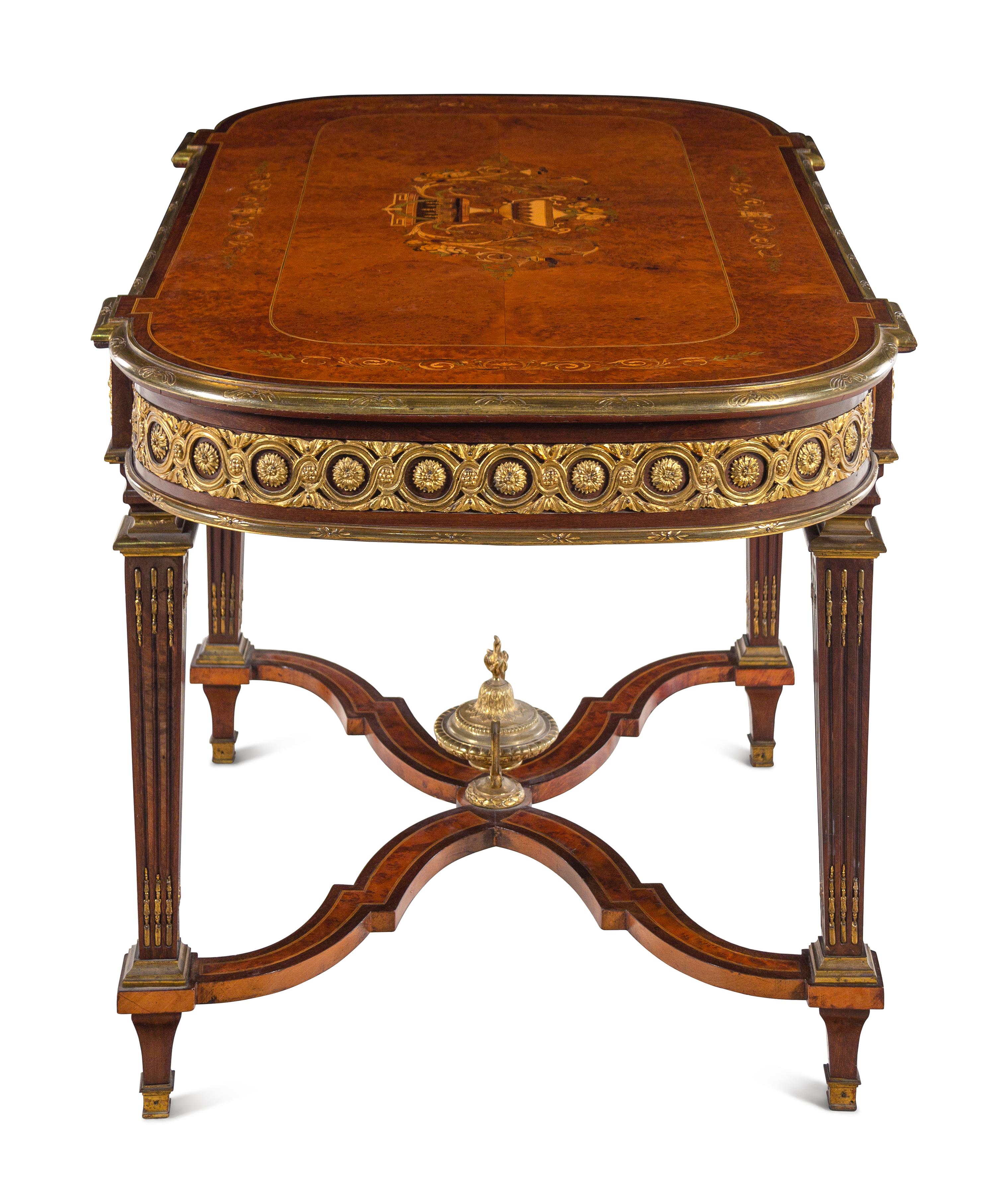 A Louis XVI Style Gilt Bronze Mounted Amboyna and Marquetry Center Table