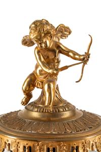 A French Gilt Bronze and Sèvres Style Porcelain Clock Garniture