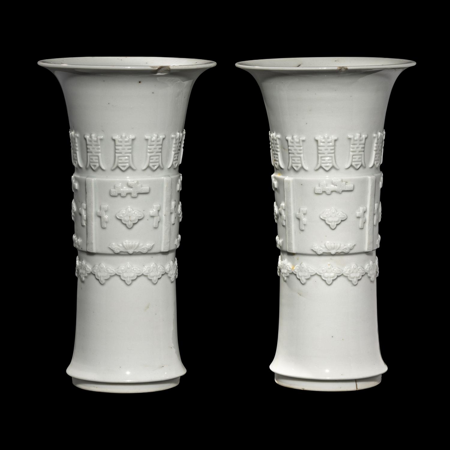A Pair of Chinese Blanc-de-Chine Porcelain Gu Vases, Qing Dynasty 清 德化白瓷貼塑萬壽 如意花觚 一對