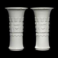 A Pair of Chinese Blanc-de-Chine Porcelain Gu Vases, Qing Dynasty 清 德化白瓷貼塑萬壽 如意花觚 一對