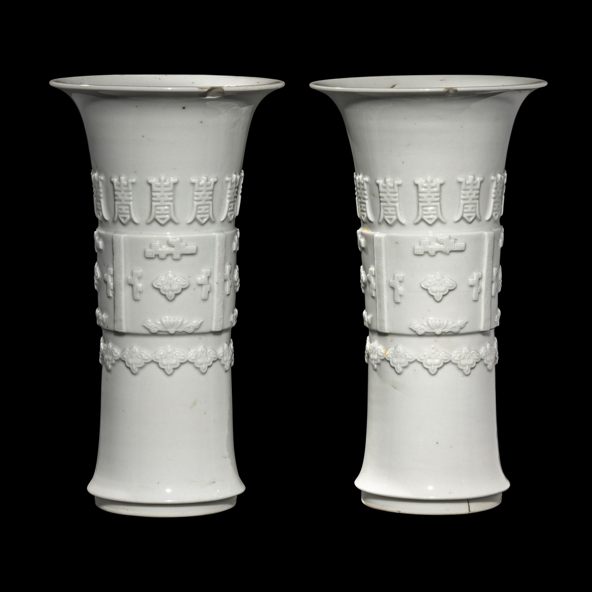 A Pair of Chinese Blanc-de-Chine Porcelain Gu Vases, Qing Dynasty 清 德化白瓷貼塑萬壽 如意花觚 一對