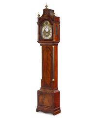 A George III Brass Mounted and Figured Mahogany Tall Case Clock