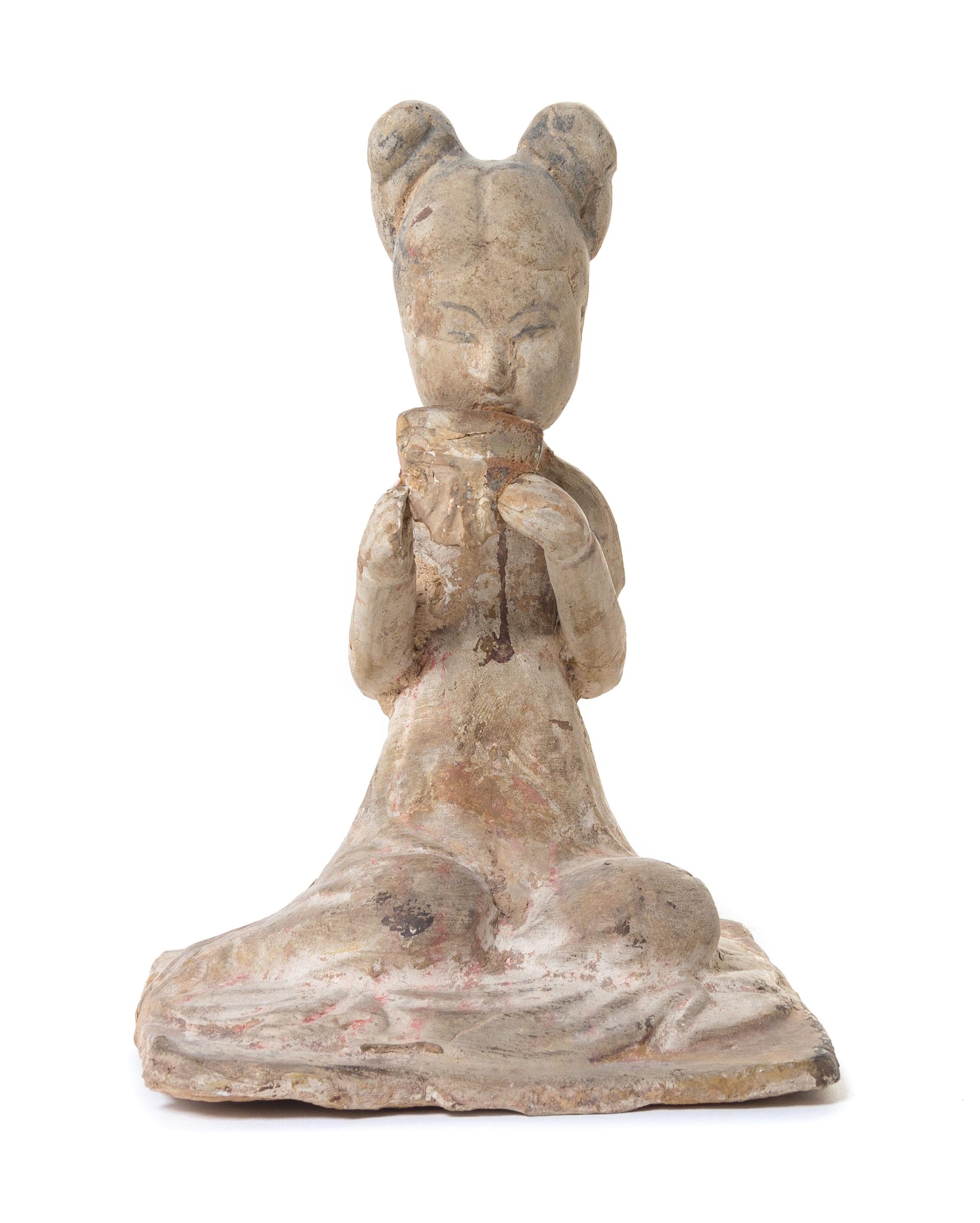 A Pottery Figure of a Female Musician — TANG DYNASTY