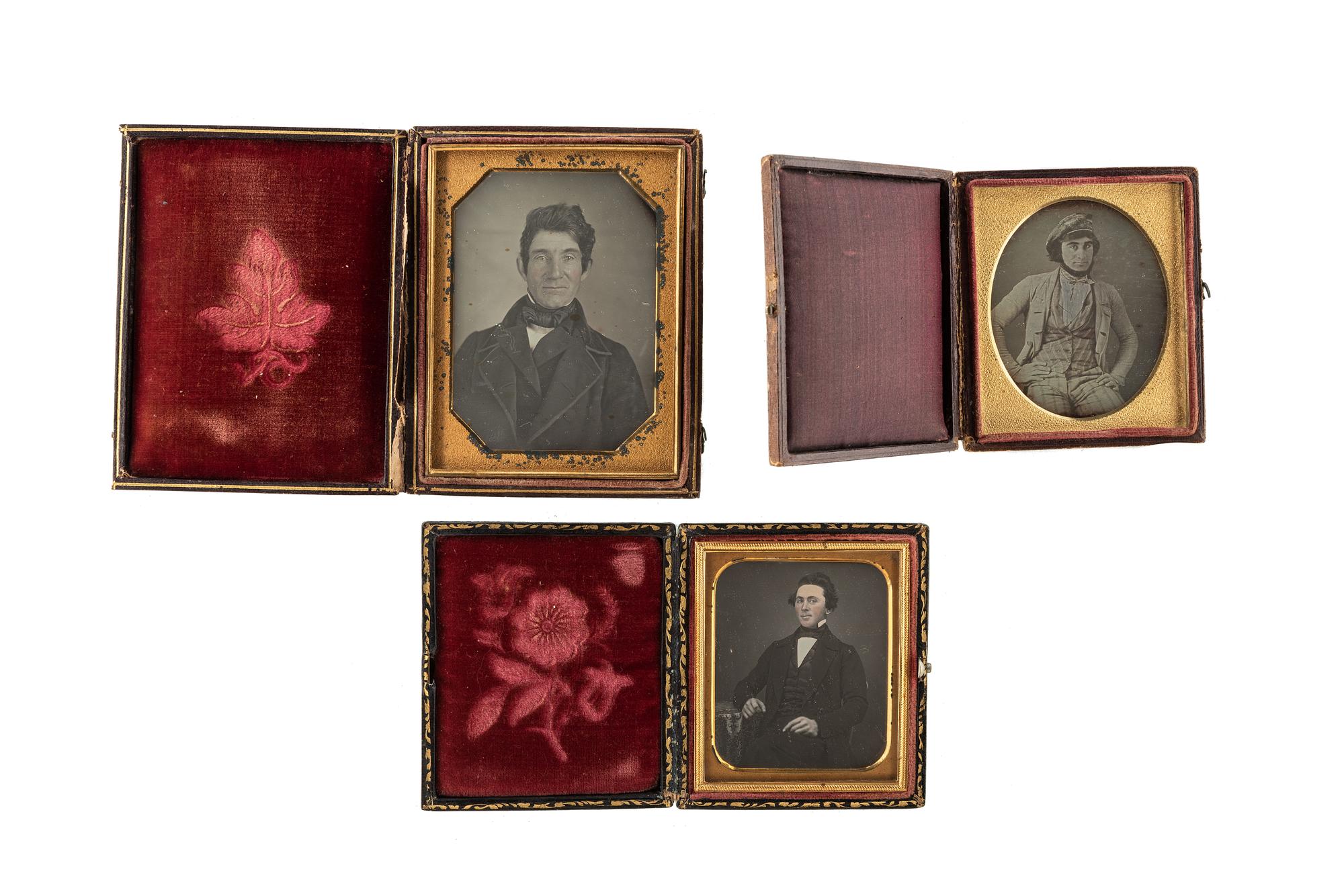 [EARLY PHOTOGRAPHY - PORTRAITURE]. A group of 7 daguerreotype and ambrotype portraits of men, many with interesting and unusual expressions and features, highlighted by full plate ambrotype of group of distinguished gents.