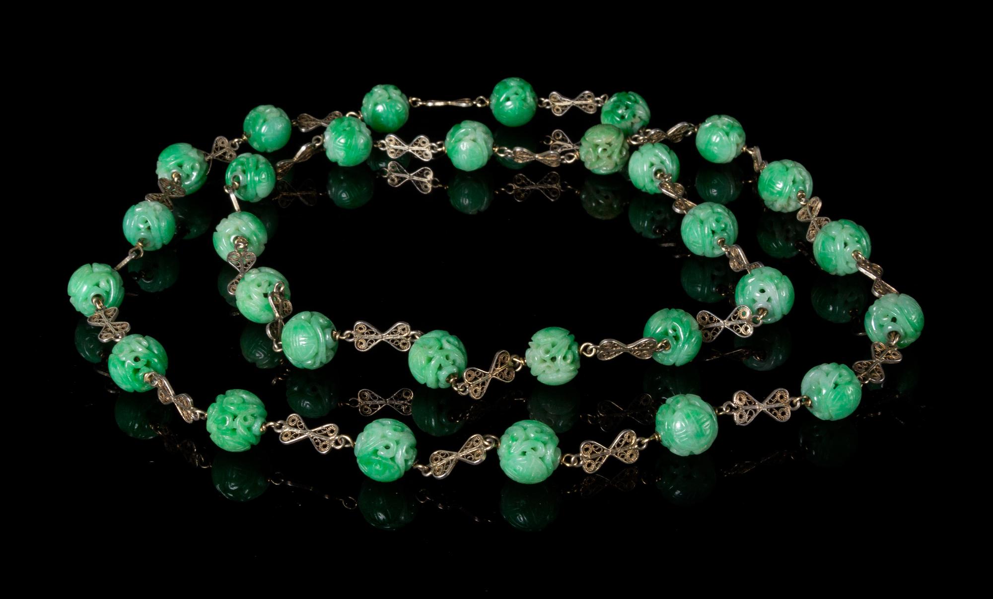 A Beaded Jadeite Necklace Length 21 inches.