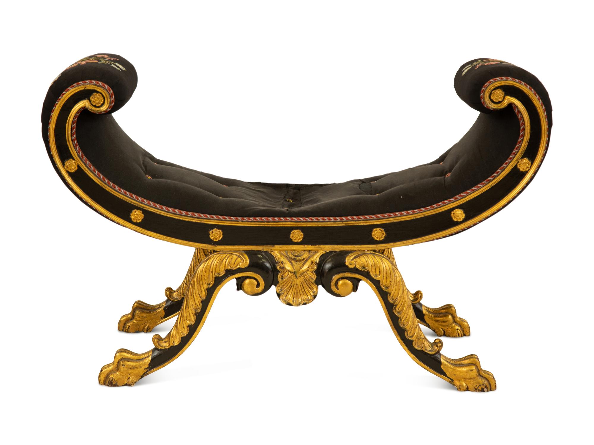 A Regency Ebonized and Parcel Gilt Curule Form Bench