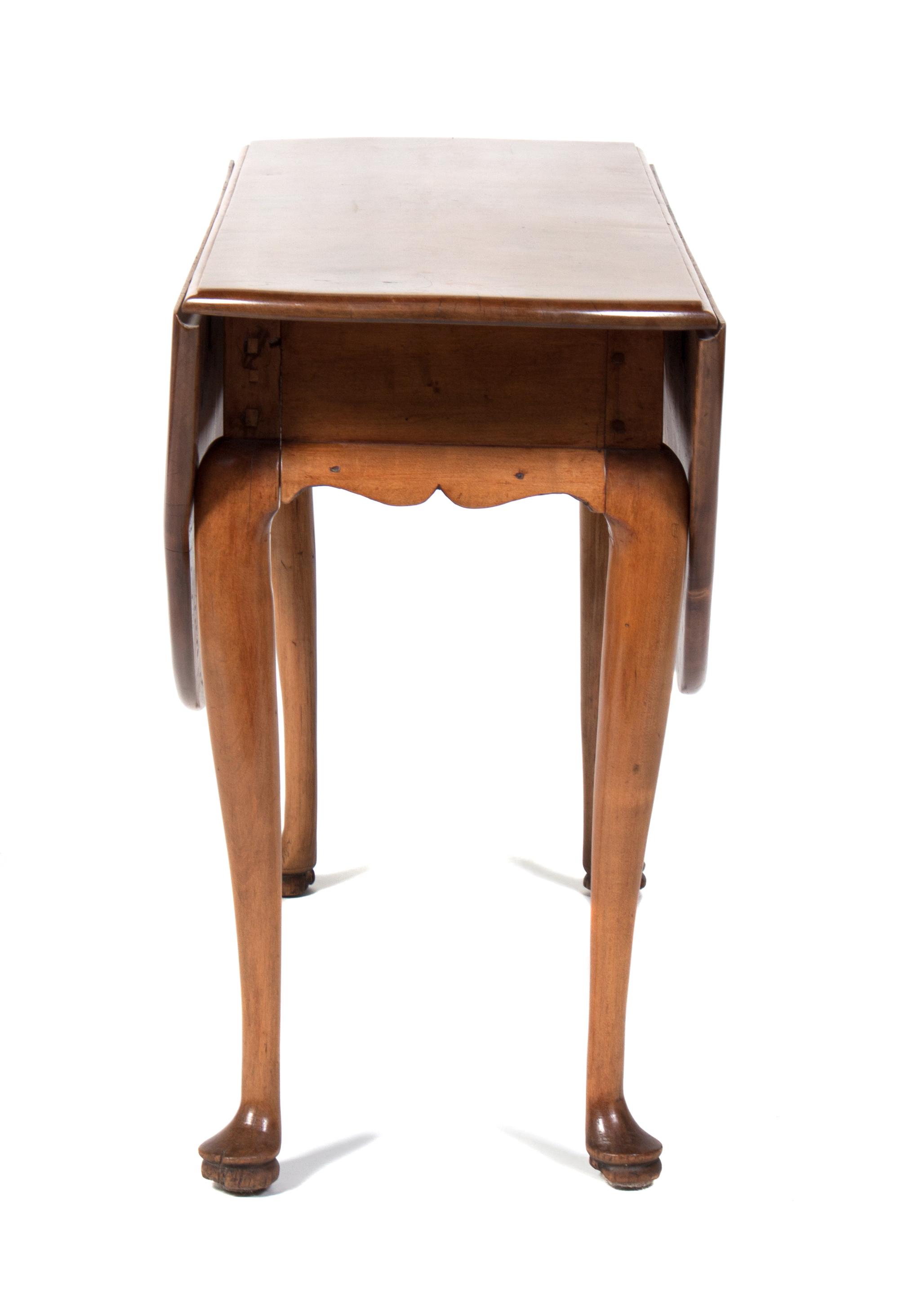 A Drop-Leaf Table Height 27 1/2 inches.
