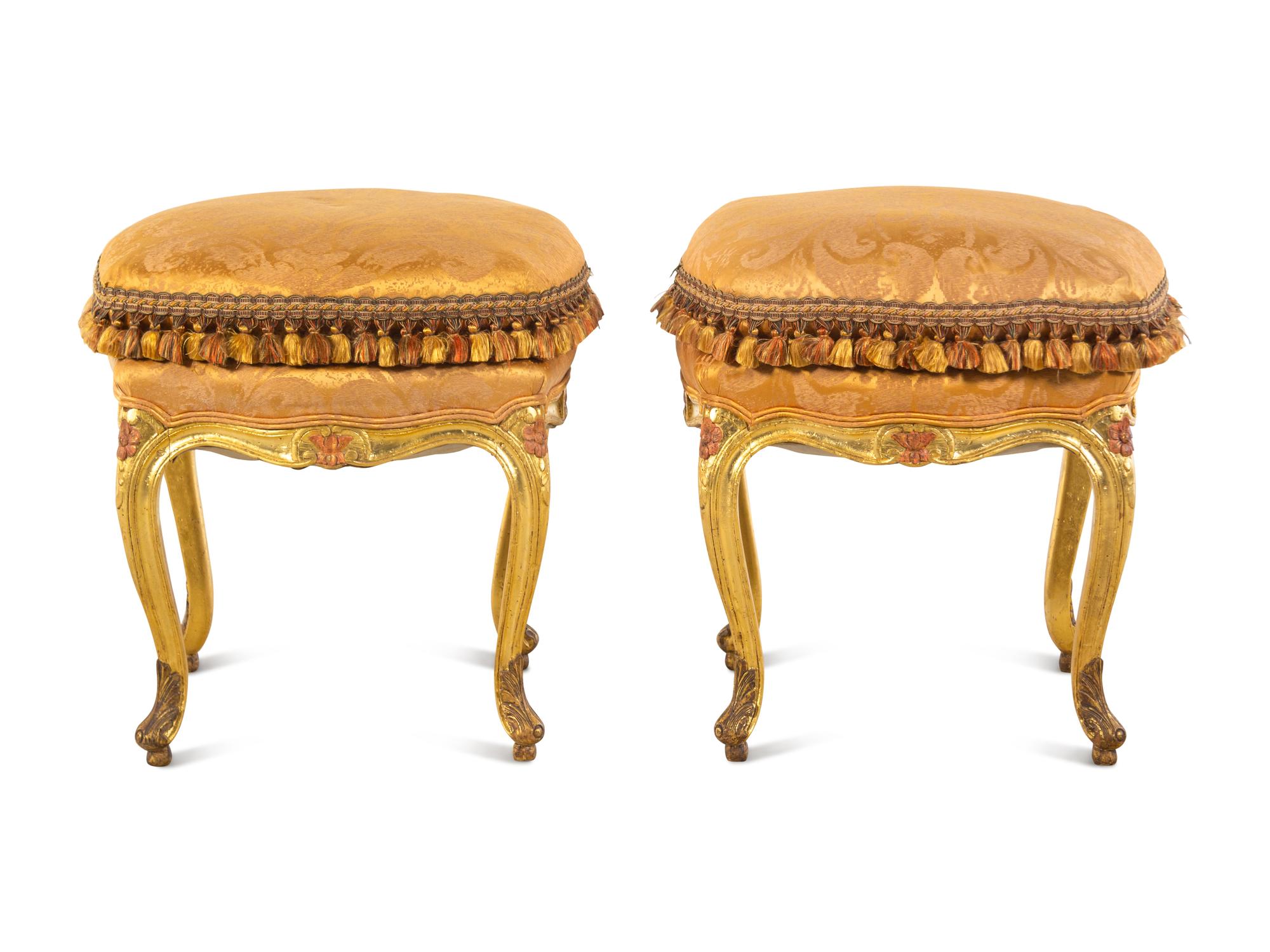 A Pair of Louis XV Giltwood Tabourets