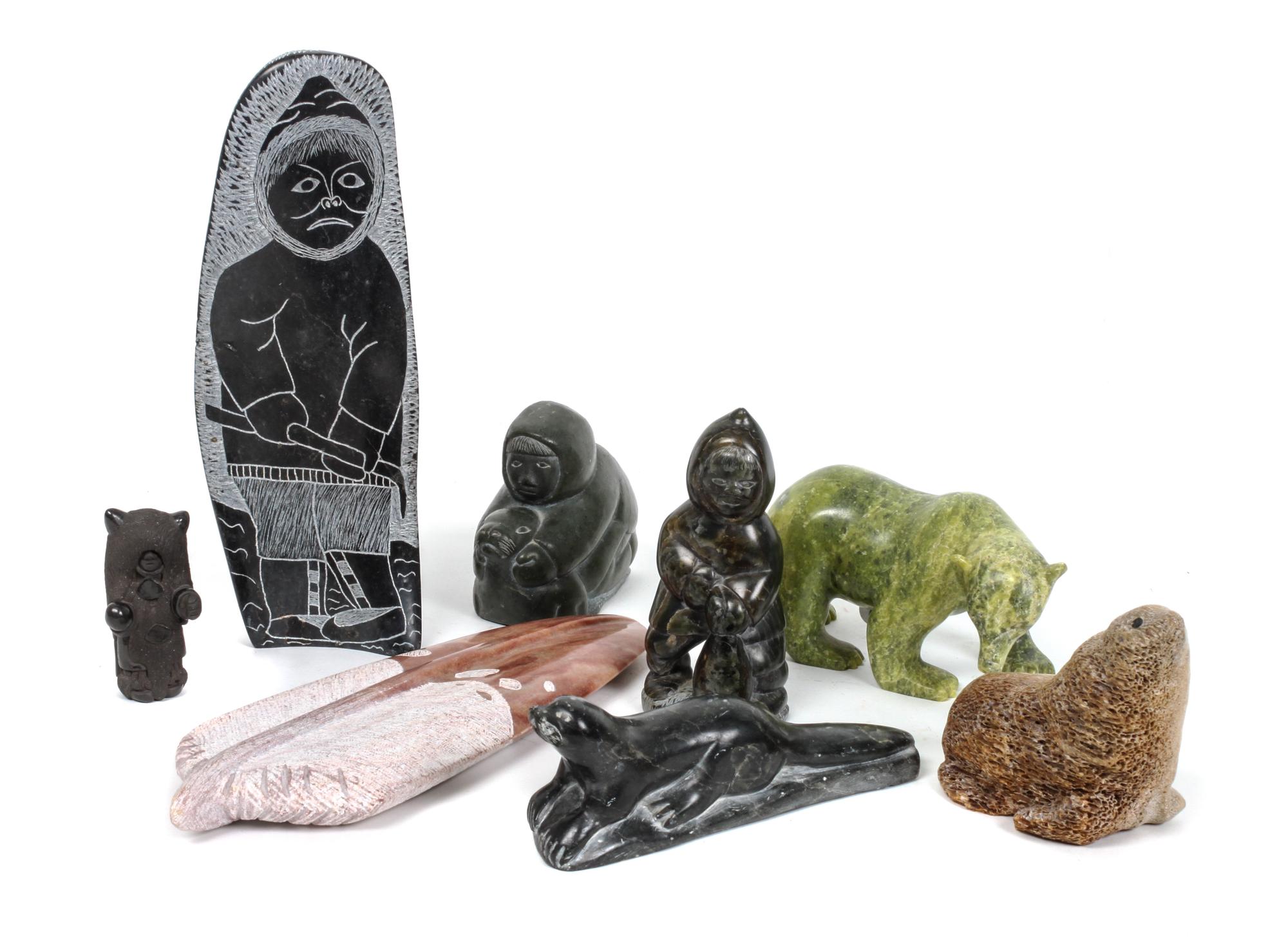 Eight Inuit Carvings Height of largest 8 3/4 inches.