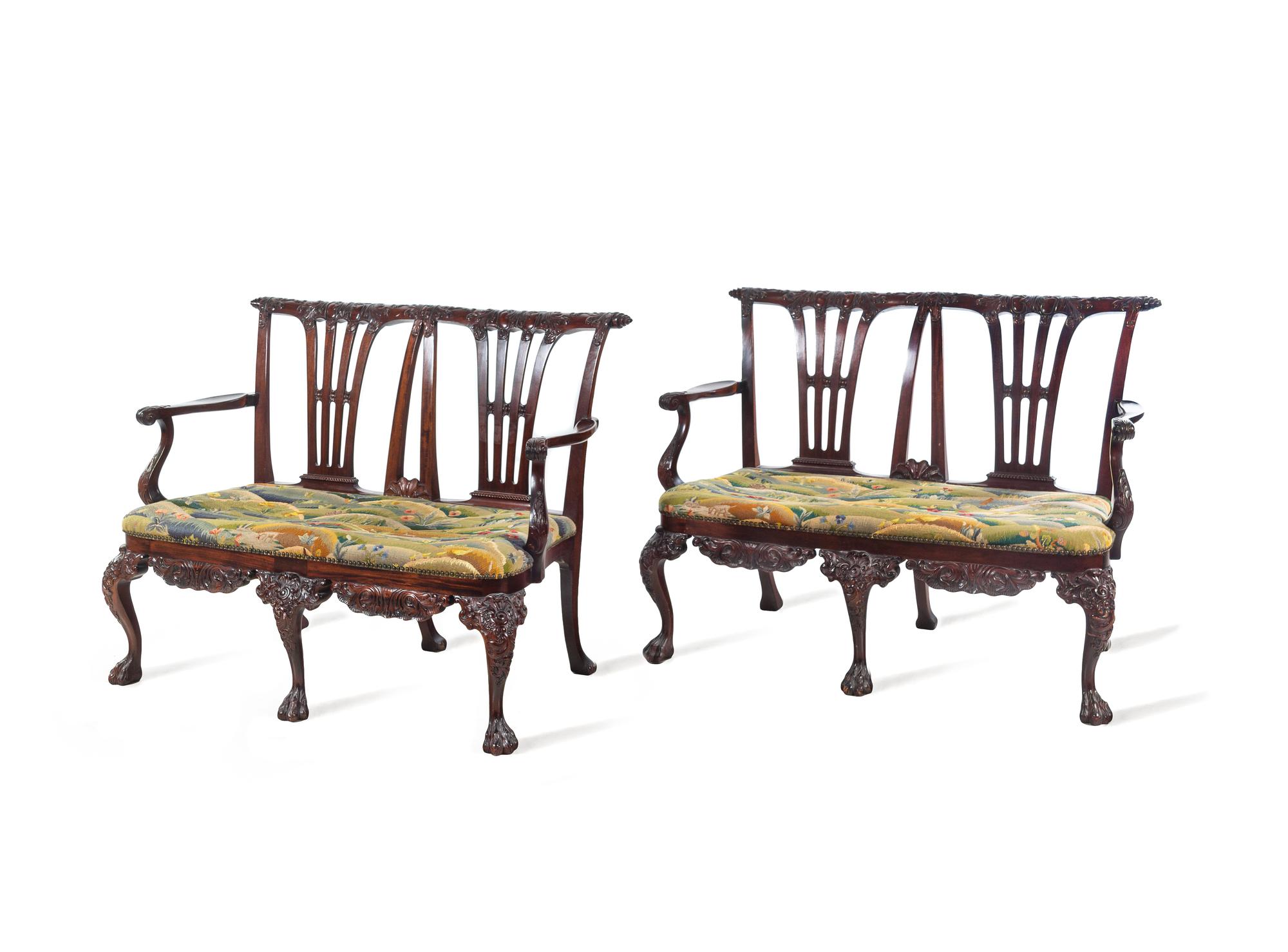 A Pair of Irish George II Style Carved Mahogany Double-Back Settees