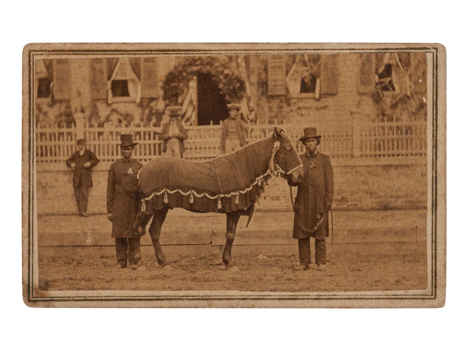 [LINCOLN, Abraham (1860-1865)]. CDV of Lincoln's Horse, "Old Robin" led by African American Reverend Henry Brown at the funeral. Springfield, IL: F.W. Ingmire, [4 May 1865].