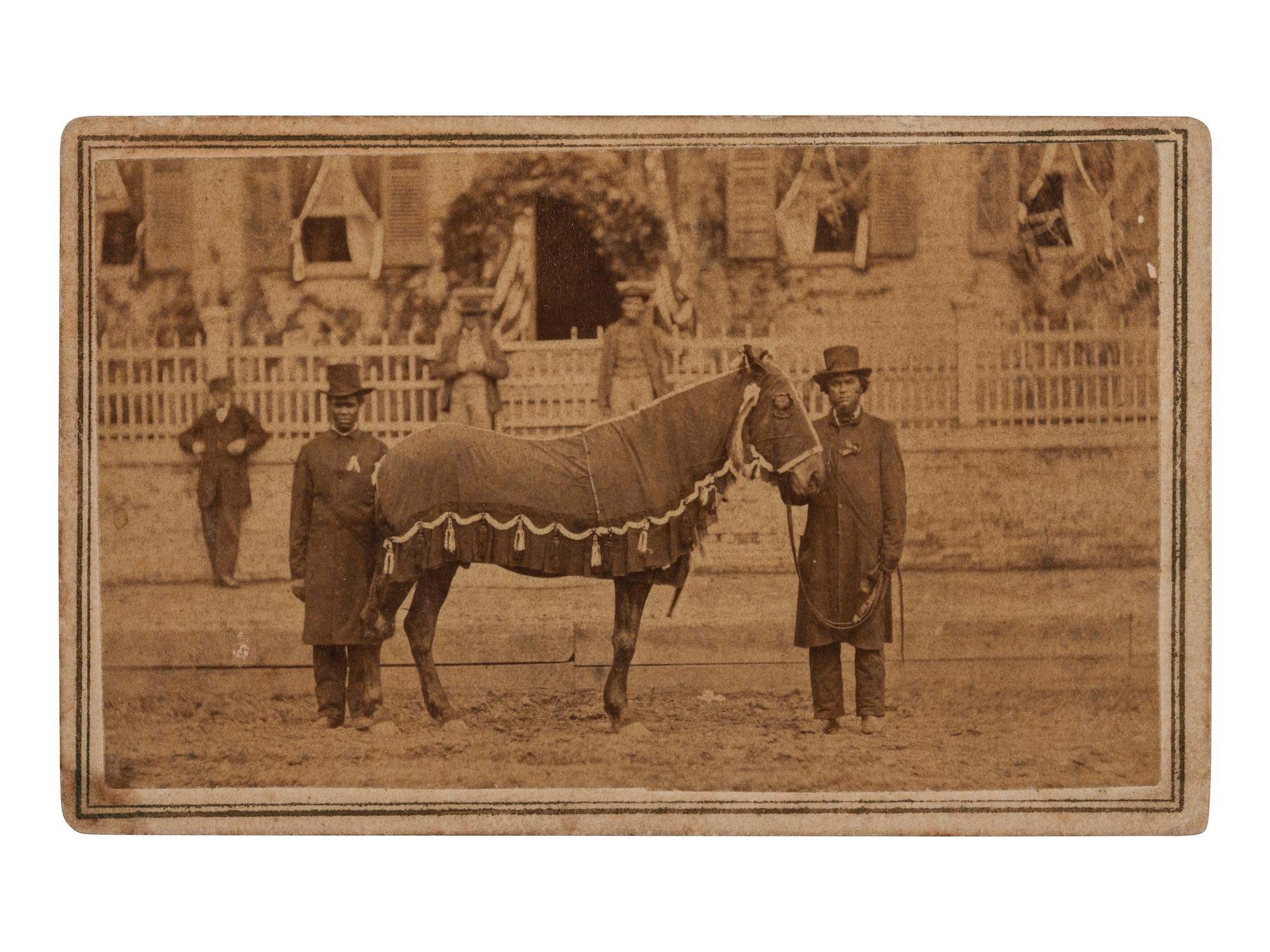 [LINCOLN, Abraham (1860-1865)]. CDV of Lincoln's Horse, "Old Robin" led by African American Reverend Henry Brown at the funeral. Springfield, IL: F.W. Ingmire, [4 May 1865].