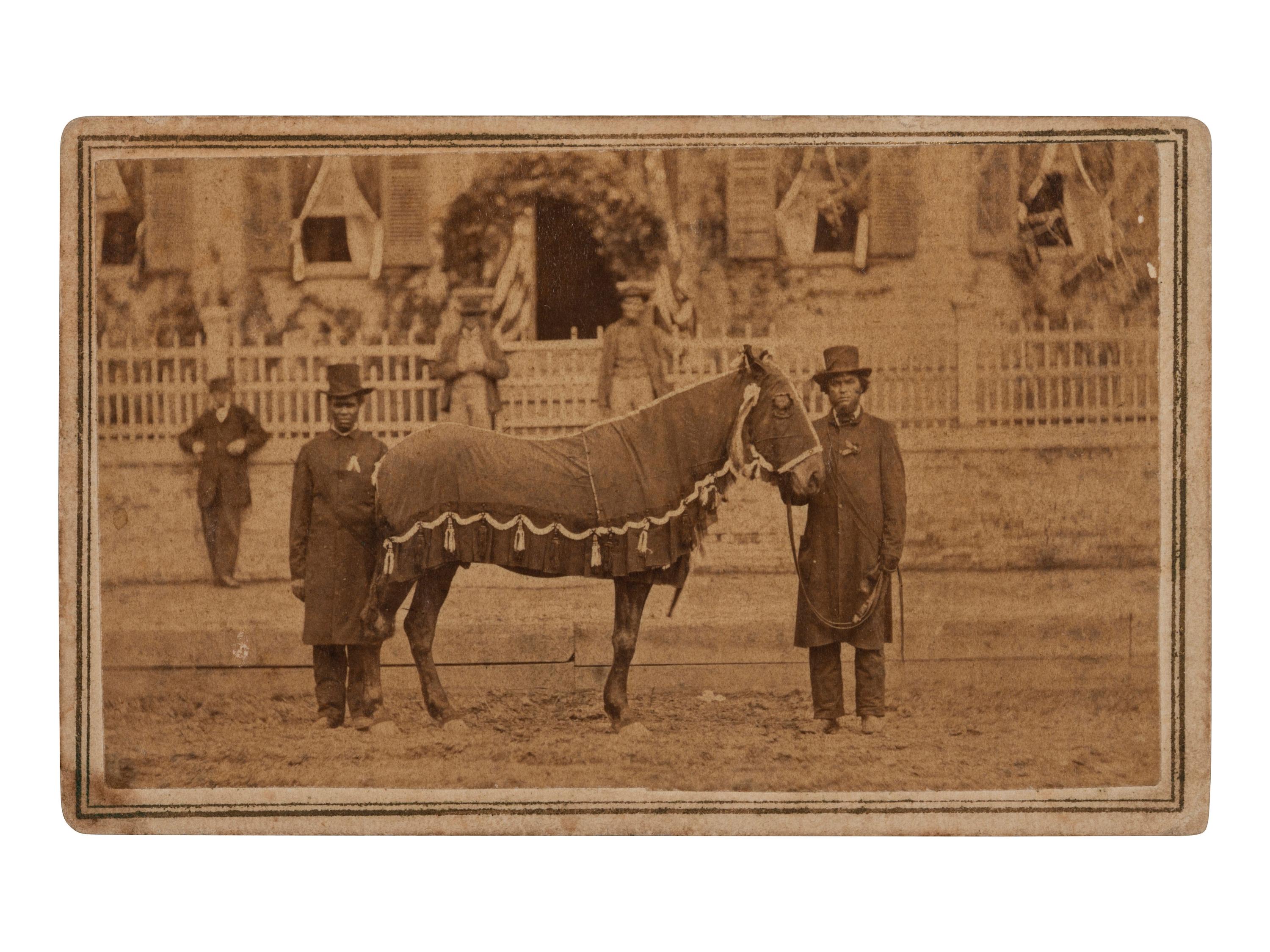 [LINCOLN, Abraham (1860-1865)]. CDV of Lincoln's Horse, "Old Robin" led by African American Reverend Henry Brown at the funeral. Springfield, IL: F.W. Ingmire, [4 May 1865].