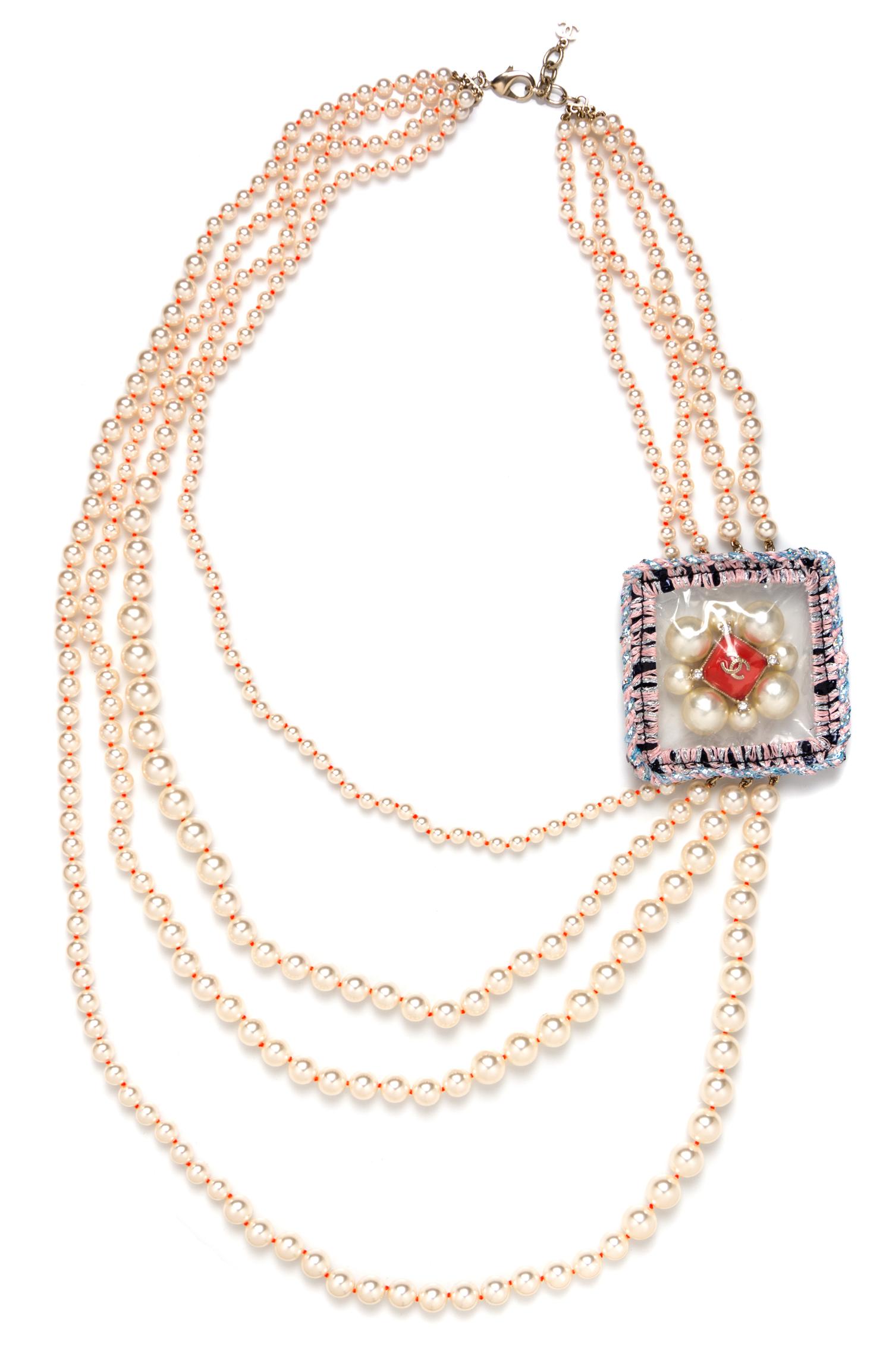 A Chanel Four Strand Faux Pearl Necklace, 34.5" x 3".