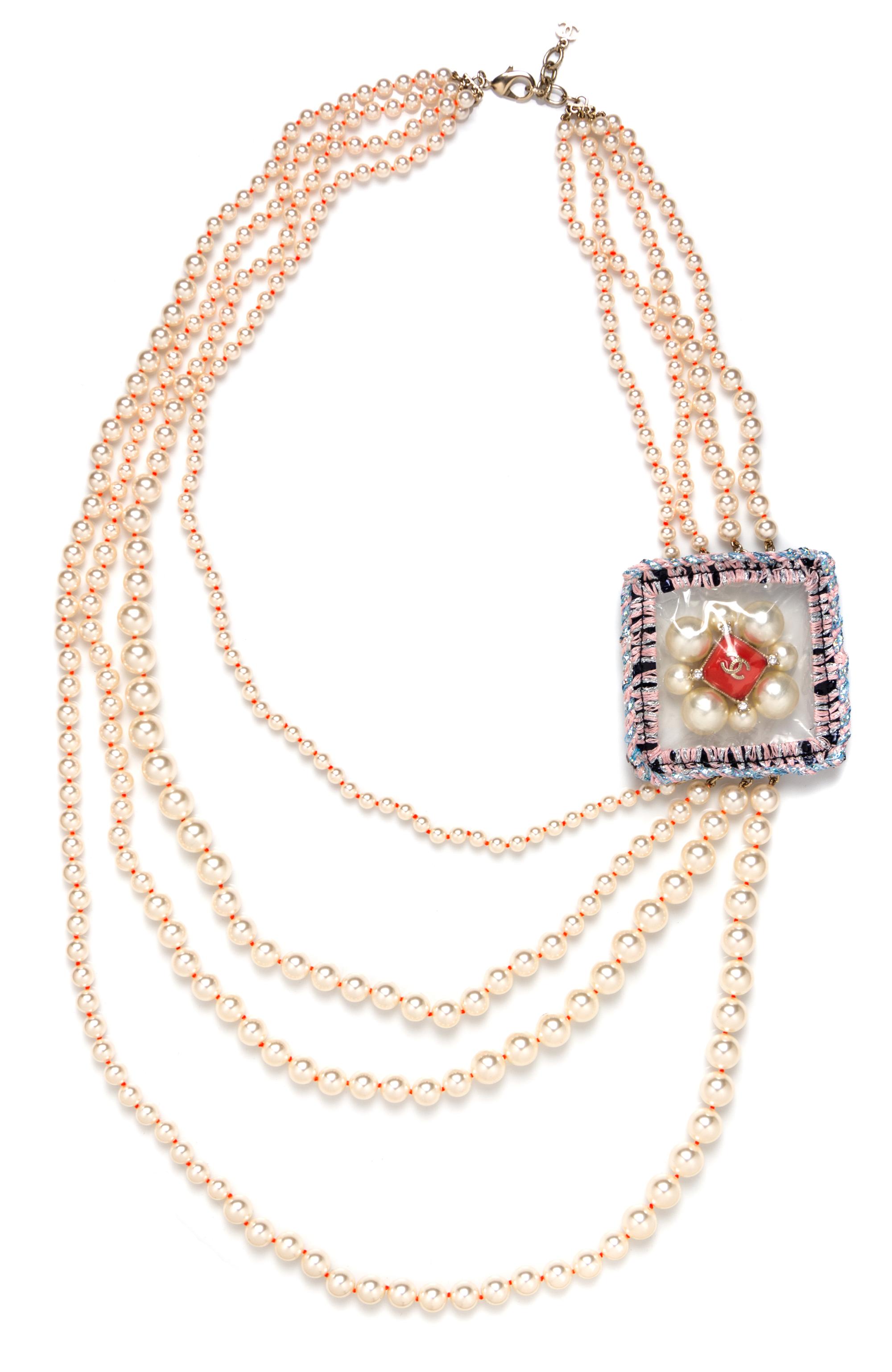 A Chanel Four Strand Faux Pearl Necklace, 34.5" x 3".