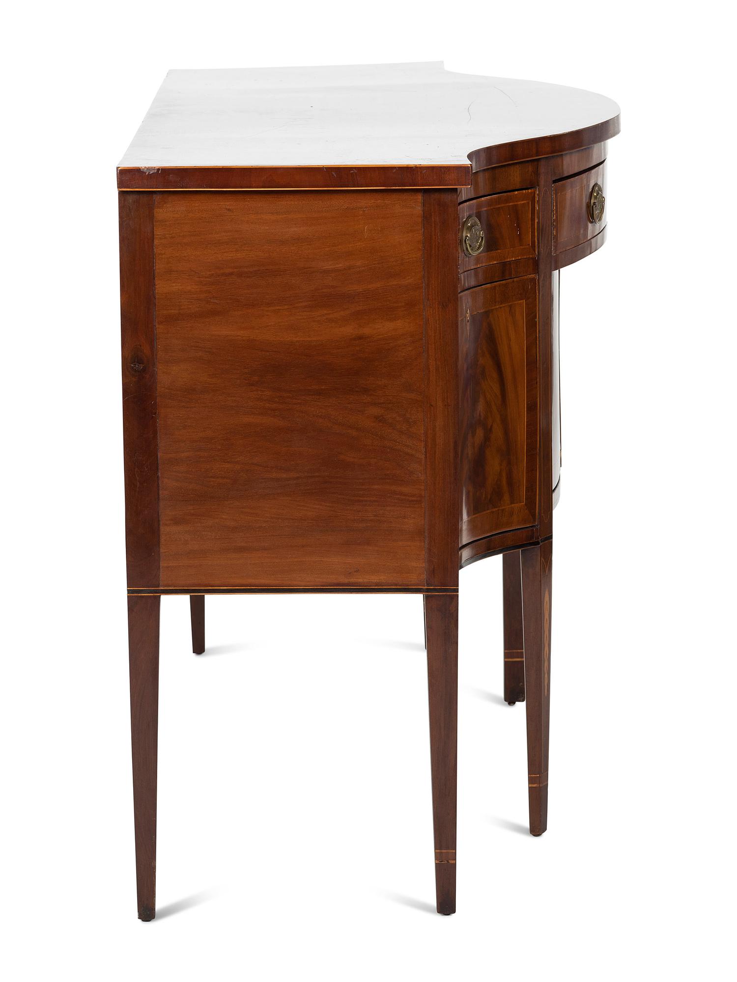 A Federal Inlaid and Figured Mahogany Serpentine Sideboard