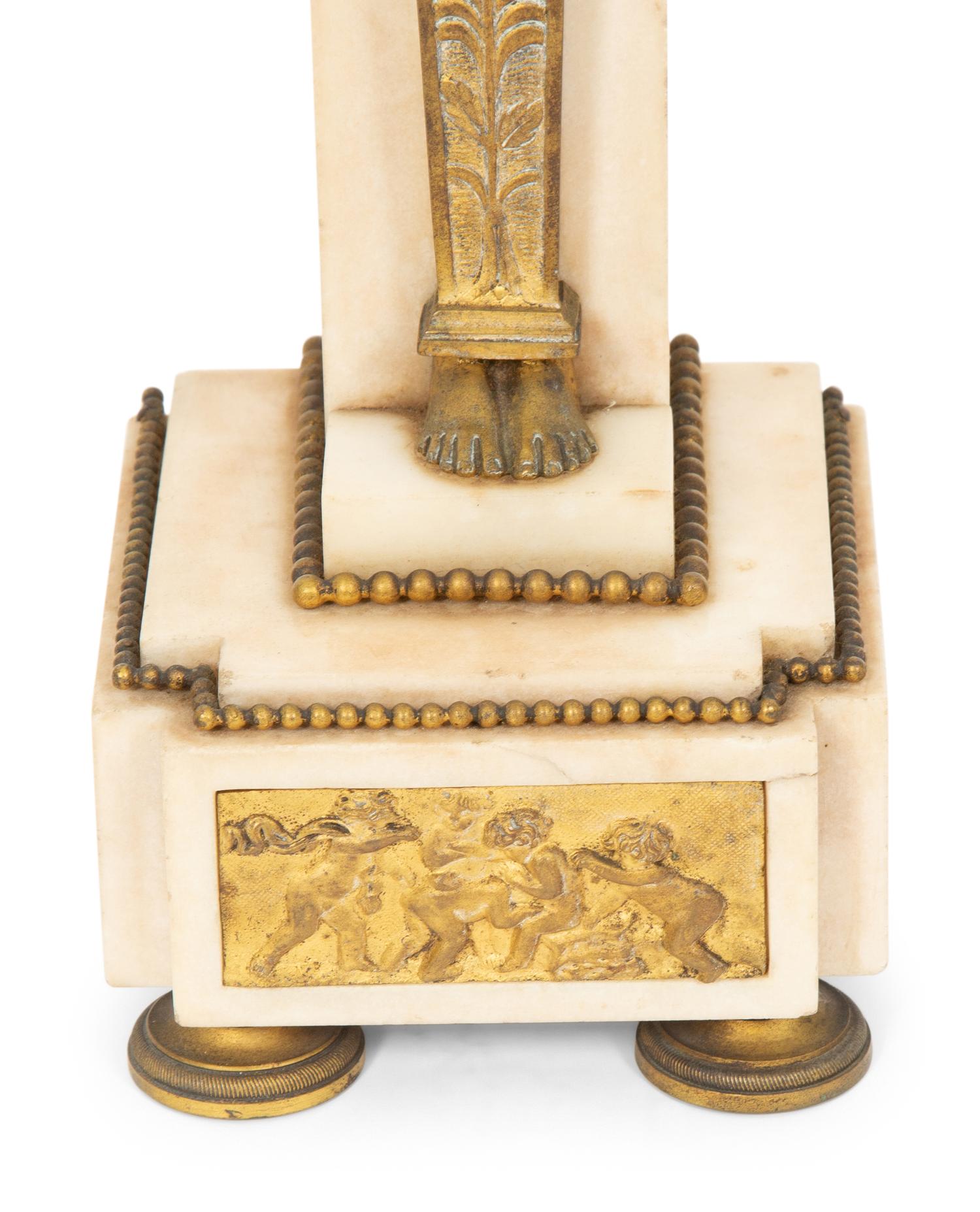 A Pair of Louis Philippe Gilt Metal and Marble Four-Light Candelabra