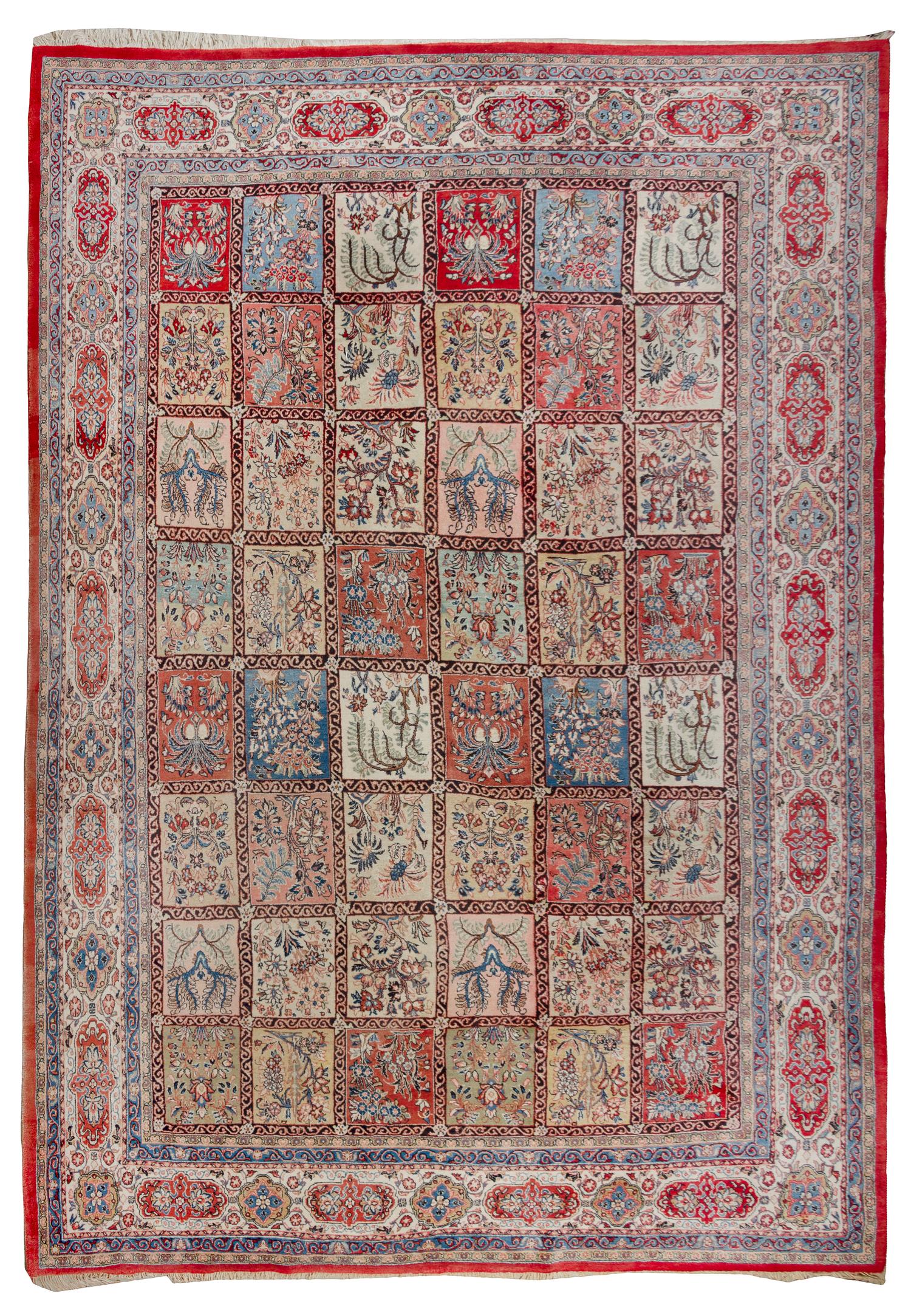 A Persian Wool Garden Carpet 14 feet 2 inches x 9 feet 10 inches.
