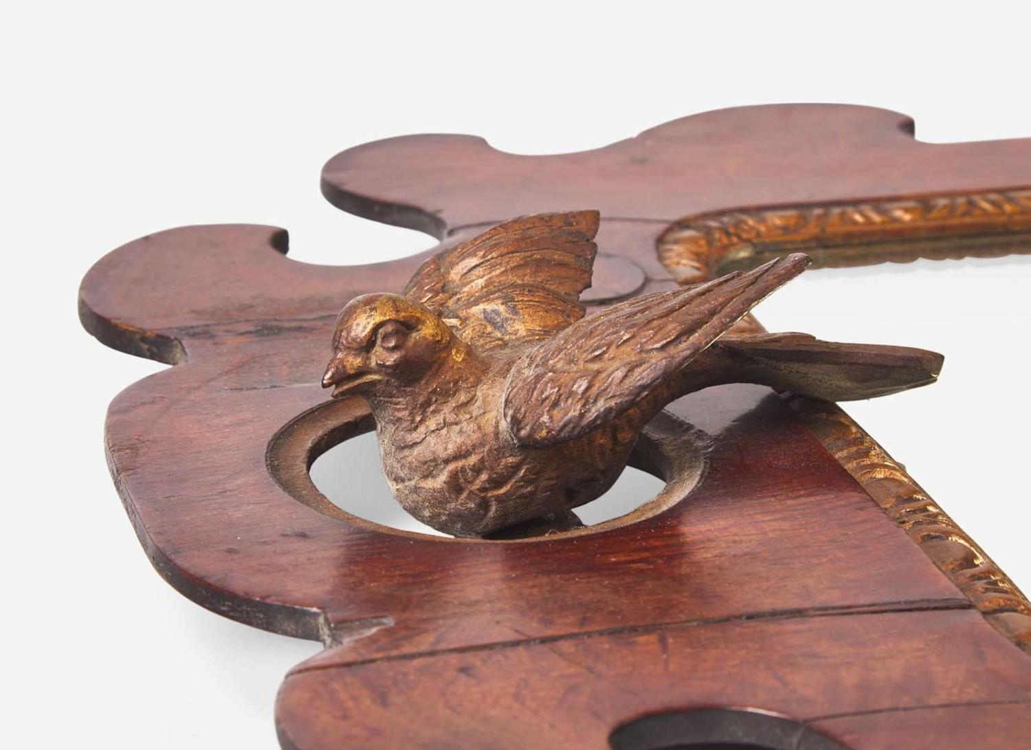 A group of four Queen Anne and Chippendale fret-carved mahogany and parcel-gilt looking glasses, 18th / 19th century
