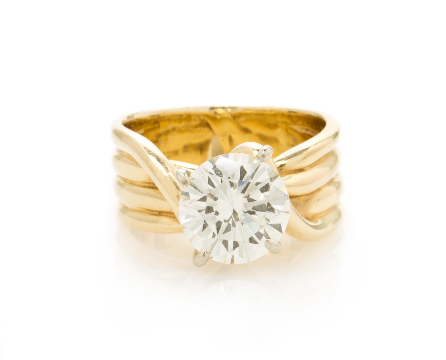A 14 Karat Yellow Gold and Diamond Solitaire Ring, 6.10 dwts.