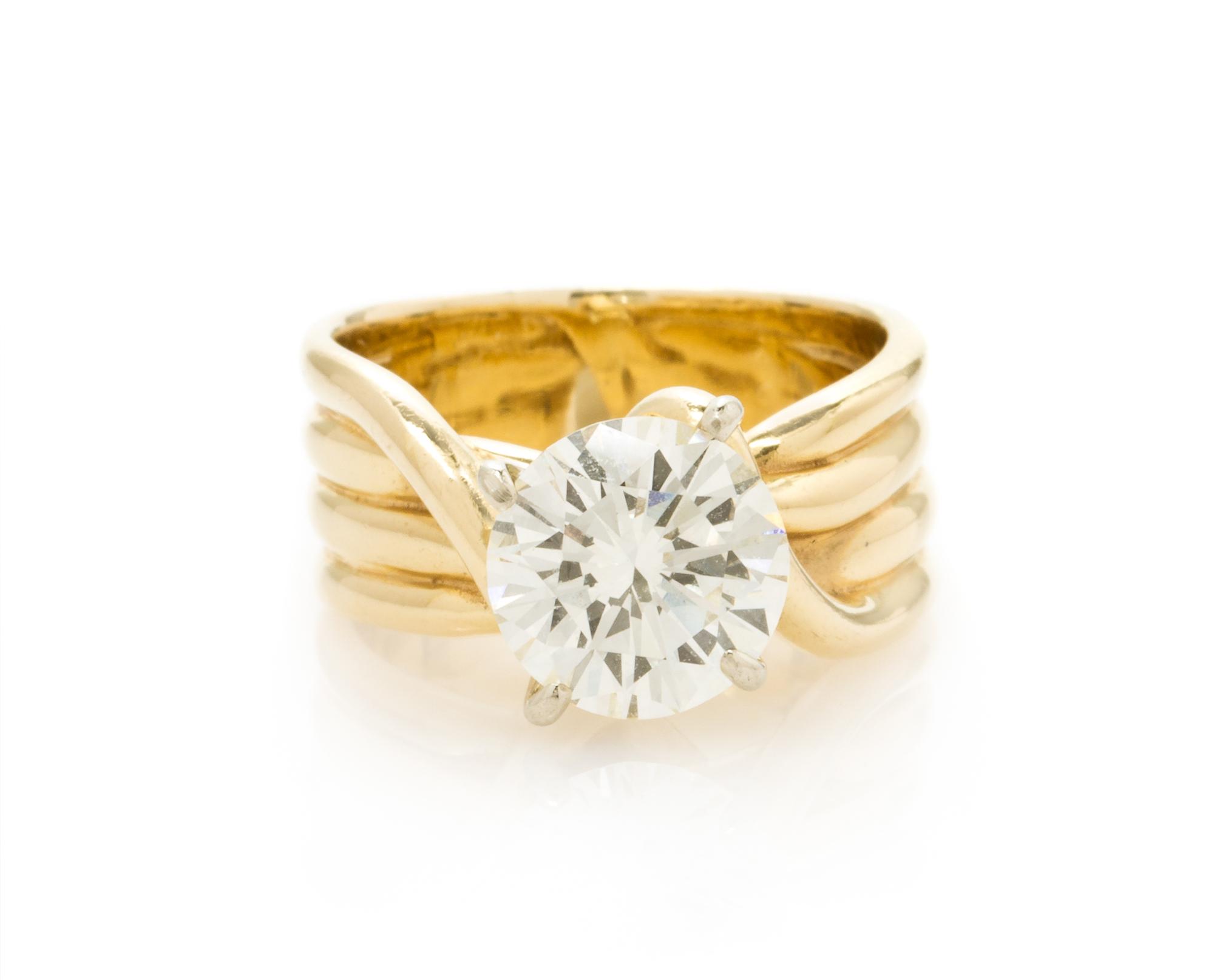 A 14 Karat Yellow Gold and Diamond Solitaire Ring, 6.10 dwts.