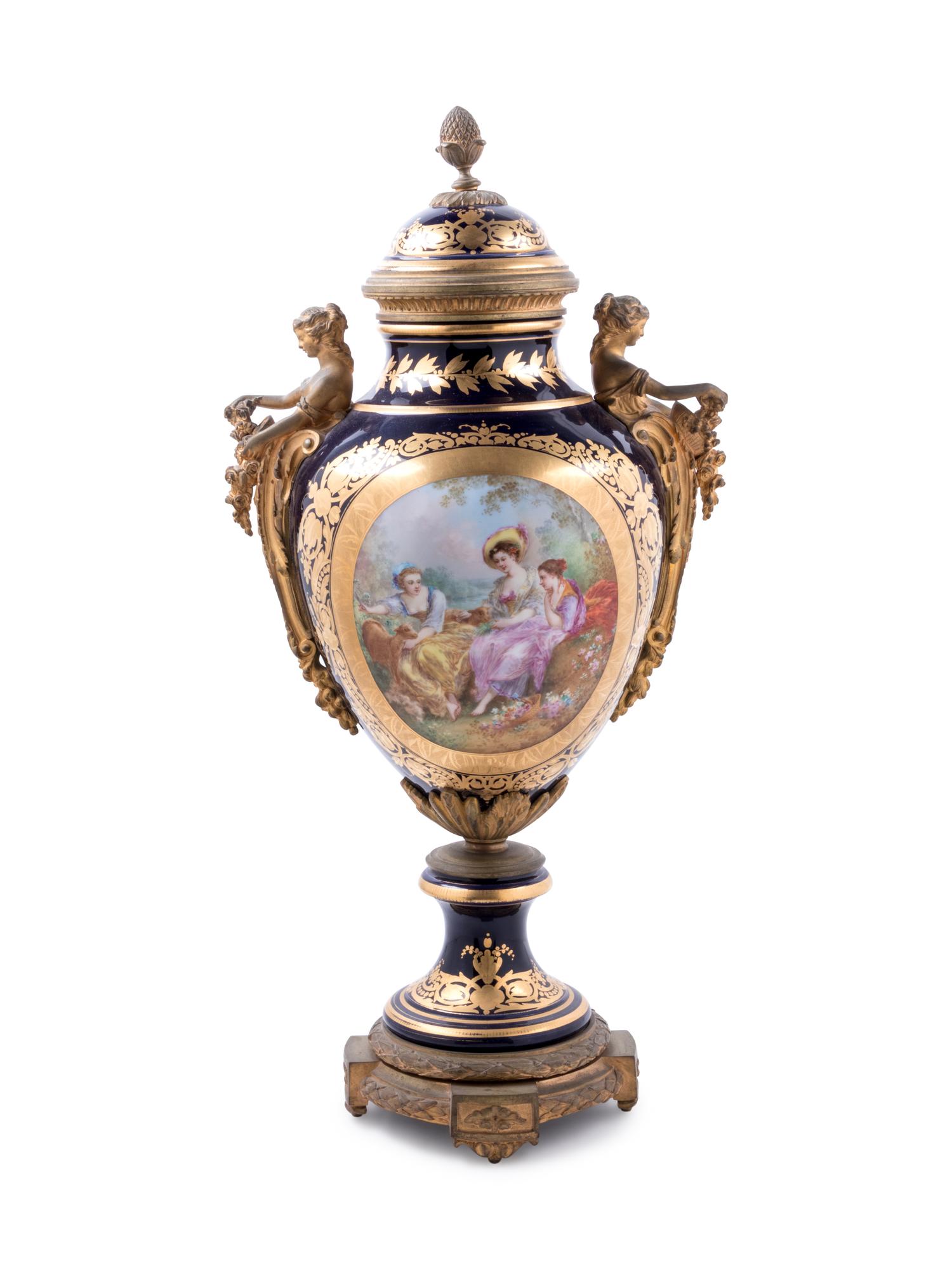 A Sèvres Style Gilt Bronze Mounted Painted and Parcel Gilt Porcelain Covered Urn